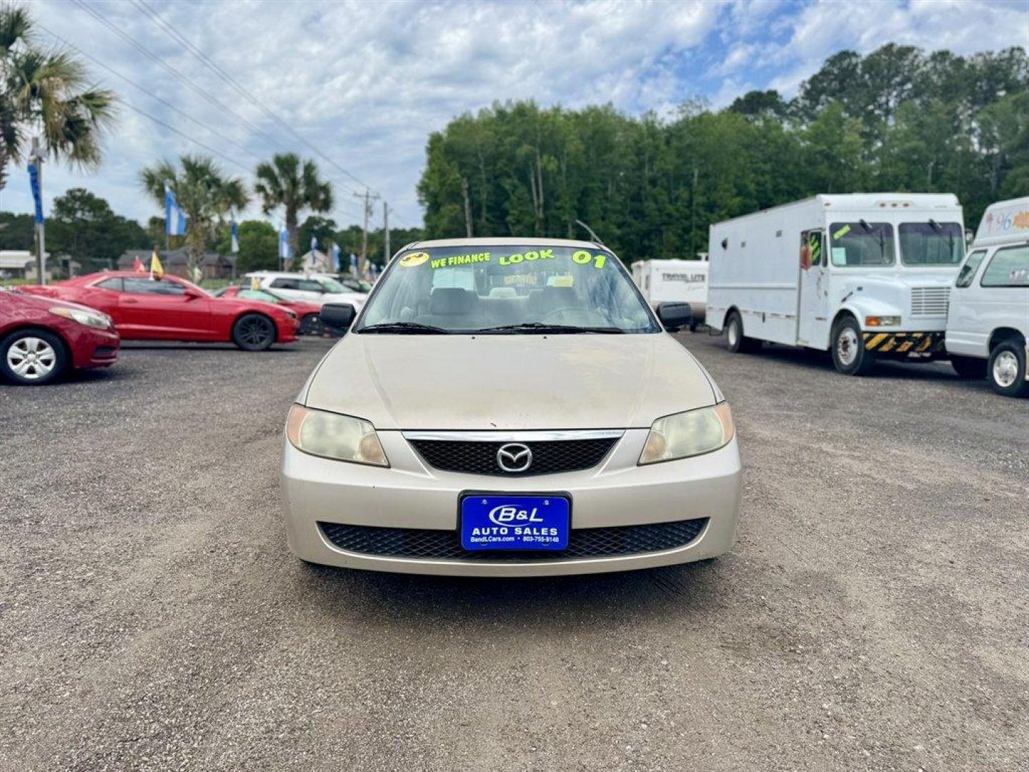 2001 Gold /Tan Mazda Protege (JM1BJ222210) with an 1.6l I-4 MPI Dohc 1.6l engine, Manual transmission, located at 745 East Steele Rd., West Columbia, SC, 29170, (803) 755-9148, 33.927212, -81.148483 - Special Internet Price! 2001 Mazda Protege - Photo#1