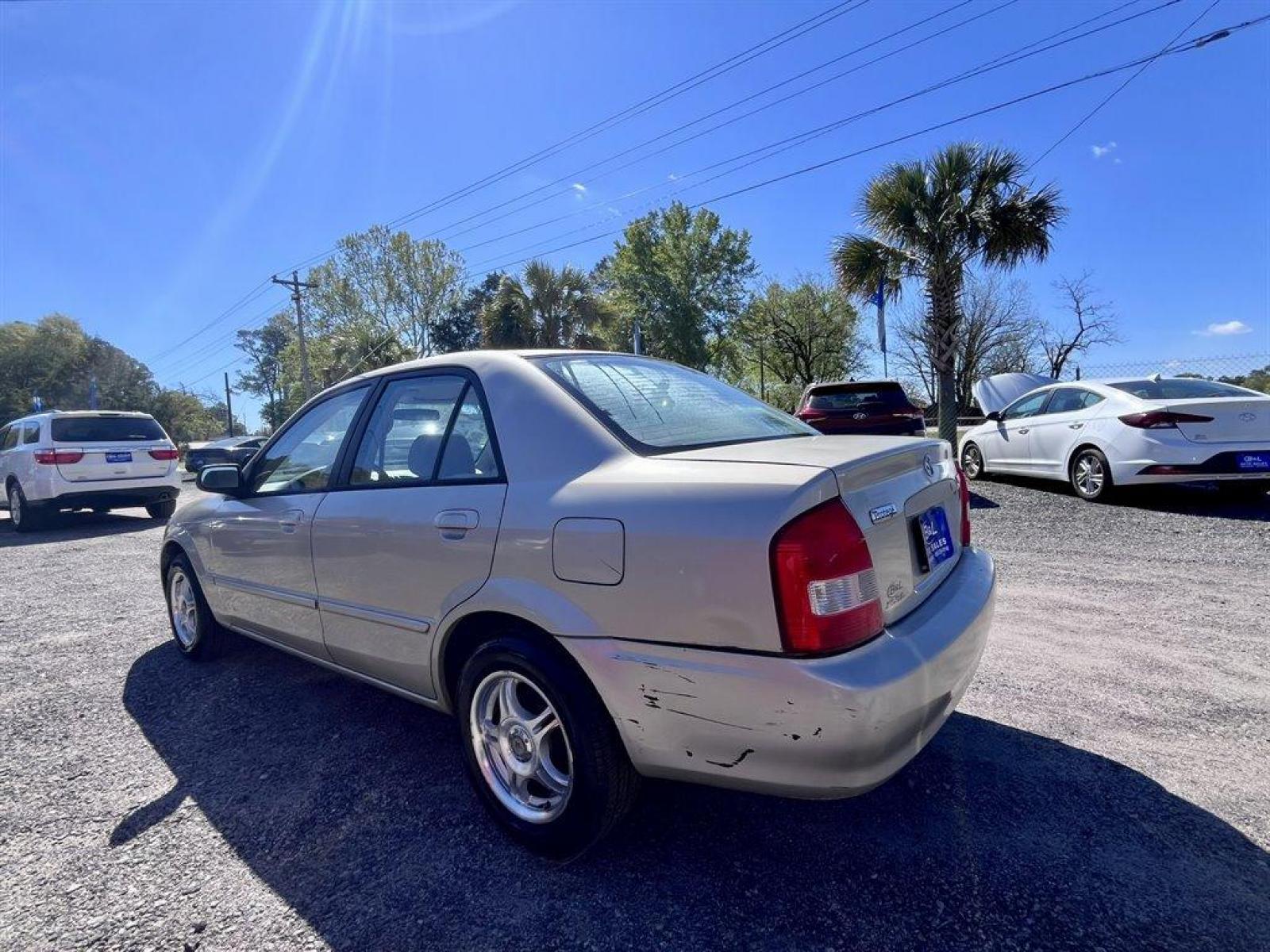 2001 Gold /Tan Mazda Protege (JM1BJ222210) with an 1.6l I-4 MPI Dohc 1.6l engine, Manual transmission, located at 745 East Steele Rd., West Columbia, SC, 29170, (803) 755-9148, 33.927212, -81.148483 - Special Internet Price! 2001 Mazda Protege with AM/FM stereo, Keyless remote, Air conditioning, Cruise control, Sunroof, Manual transmission, Cloth reclining front bucket seats, 60/40 split fold-down rear, Powered windows, Plus more! - Photo #1