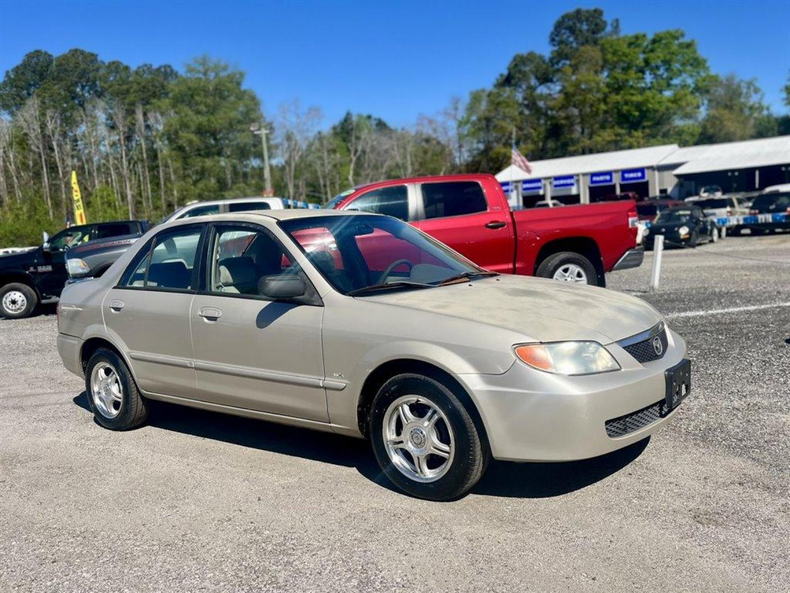 2001 Gold /Tan Mazda Protege (JM1BJ222210) with an 1.6l I-4 MPI Dohc 1.6l engine, Manual transmission, located at 745 East Steele Rd., West Columbia, SC, 29170, (803) 755-9148, 33.927212, -81.148483 - Special Internet Price! 2001 Mazda Protege with AM/FM stereo, Keyless remote, Air conditioning, Cruise control, Sunroof, Manual transmission, Cloth reclining front bucket seats, 60/40 split fold-down rear, Powered windows, Plus more! - Photo #3