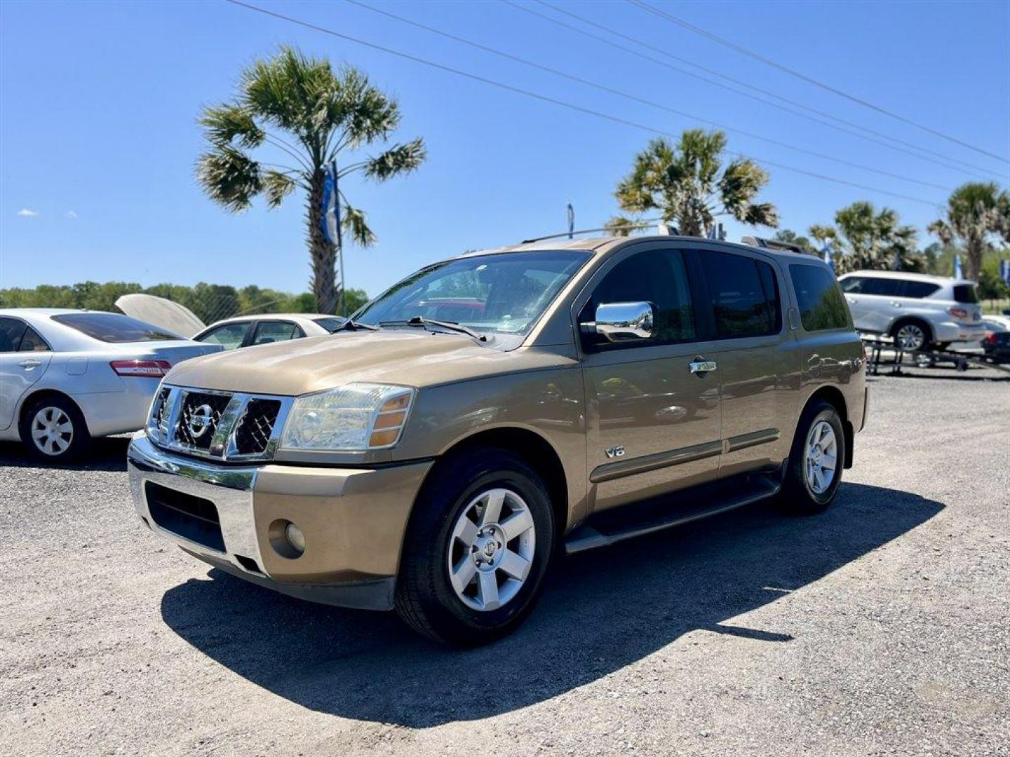 2005 Gold /Black Nissan Armada (5N1AA08A45N) with an 5.6l V8 MPI Dohc 5.6l engine, Automatic transmission, located at 745 East Steele Rd., West Columbia, SC, 29170, (803) 755-9148, 33.927212, -81.148483 - Special Internet Price! 2005 Nissan Armada LE with AM/FM radio, Air conditioning, Cruise control, Keyless entry, Leather interior, 3rd row seating, Rear entertainment, Powered liftgate, Powered windows, Powered door locks, Plus more! - Photo#0