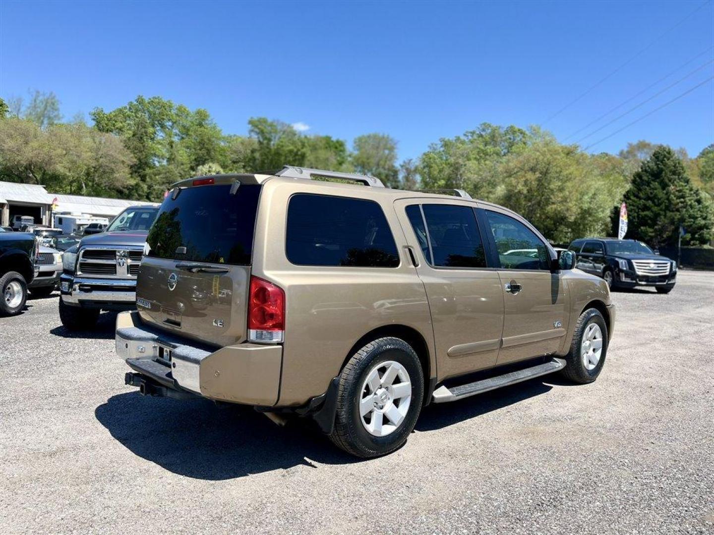 2005 Gold /Black Nissan Armada (5N1AA08A45N) with an 5.6l V8 MPI Dohc 5.6l engine, Automatic transmission, located at 745 East Steele Rd., West Columbia, SC, 29170, (803) 755-9148, 33.927212, -81.148483 - Special Internet Price! 2005 Nissan Armada LE with AM/FM radio, Air conditioning, Cruise control, Keyless entry, Leather interior, 3rd row seating, Rear entertainment, Powered liftgate, Powered windows, Powered door locks, Plus more! - Photo#2