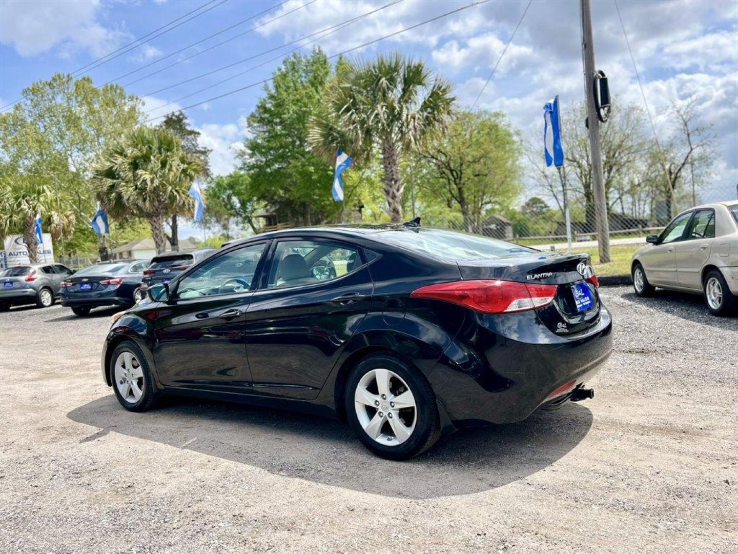 2013 Black /Tan Hyundai Elantra (KMHDH4AE8DU) with an 1.8l I-4 MPI Dohc 1.8l engine, Automatic transmission, located at 745 East Steele Rd., West Columbia, SC, 29170, (803) 755-9148, 33.927212, -81.148483 - Special Internet Price! 2013 Hyundai Elantra with Bluetooth, AM/FM/XM stereo, Remote keyless entry system, Cruise control, Cloth front bucket seats, Rear 60/40 split fold-down seat, Powered windows, Powered door locks, Plus more! - Photo#1