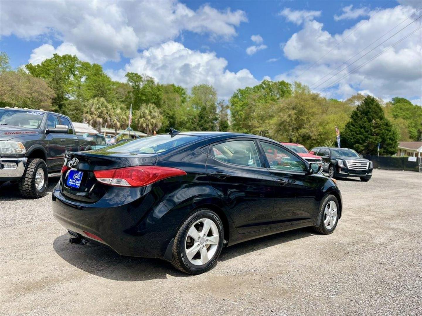 2013 Black /Tan Hyundai Elantra (KMHDH4AE8DU) with an 1.8l I-4 MPI Dohc 1.8l engine, Automatic transmission, located at 745 East Steele Rd., West Columbia, SC, 29170, (803) 755-9148, 33.927212, -81.148483 - Special Internet Price! 2013 Hyundai Elantra with Bluetooth, AM/FM/XM stereo, Remote keyless entry system, Cruise control, Cloth front bucket seats, Rear 60/40 split fold-down seat, Powered windows, Powered door locks, Plus more! - Photo#2