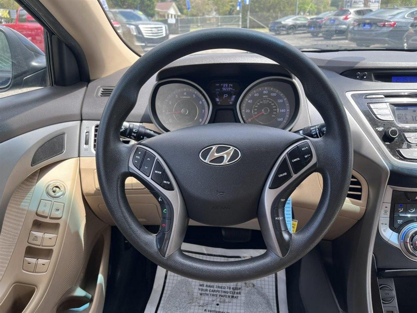 2013 Black /Tan Hyundai Elantra (KMHDH4AE8DU) with an 1.8l I-4 MPI Dohc 1.8l engine, Automatic transmission, located at 745 East Steele Rd., West Columbia, SC, 29170, (803) 755-9148, 33.927212, -81.148483 - Special Internet Price! 2013 Hyundai Elantra with Bluetooth, AM/FM/XM stereo, Remote keyless entry system, Cruise control, Cloth front bucket seats, Rear 60/40 split fold-down seat, Powered windows, Powered door locks, Plus more! - Photo#6