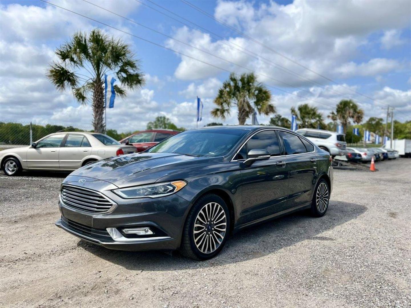 2018 Grey /Black Ford Fusion (3FA6P0D95JR) with an 2.0l I-4 DI T/C Ecoboost engine, Automatic transmission, located at 745 East Steele Rd., West Columbia, SC, 29170, (803) 755-9148, 33.927212, -81.148483 - Special Internet Price! 2018 Ford Fusion with Bluetooth, AM/FM Stereo, Sunroof, Backup camera, Cruise control, Keyless entry, Leather interior, Powered front seats, Powered windows, Powered door locks, Plus more! - Photo#0