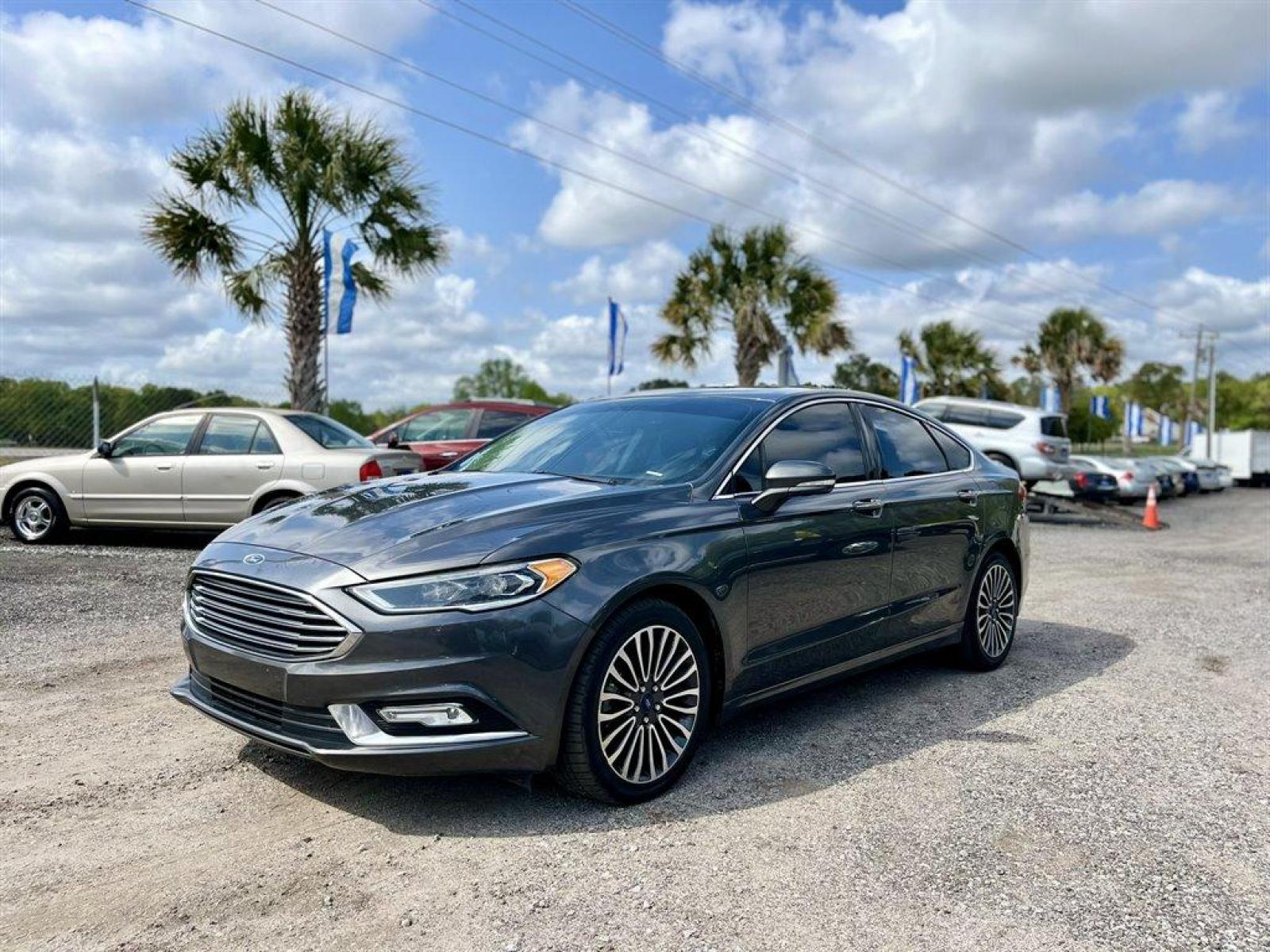 2018 Grey /Black Ford Fusion (3FA6P0D95JR) with an 2.0l I-4 DI T/C Ecoboost engine, Automatic transmission, located at 745 East Steele Rd., West Columbia, SC, 29170, (803) 755-9148, 33.927212, -81.148483 - Special Internet Price! 2018 Ford Fusion with Bluetooth, AM/FM Stereo, Sunroof, Backup camera, Cruise control, Keyless entry, Leather interior, Powered front seats, Powered windows, Powered door locks, Plus more! - Photo #0