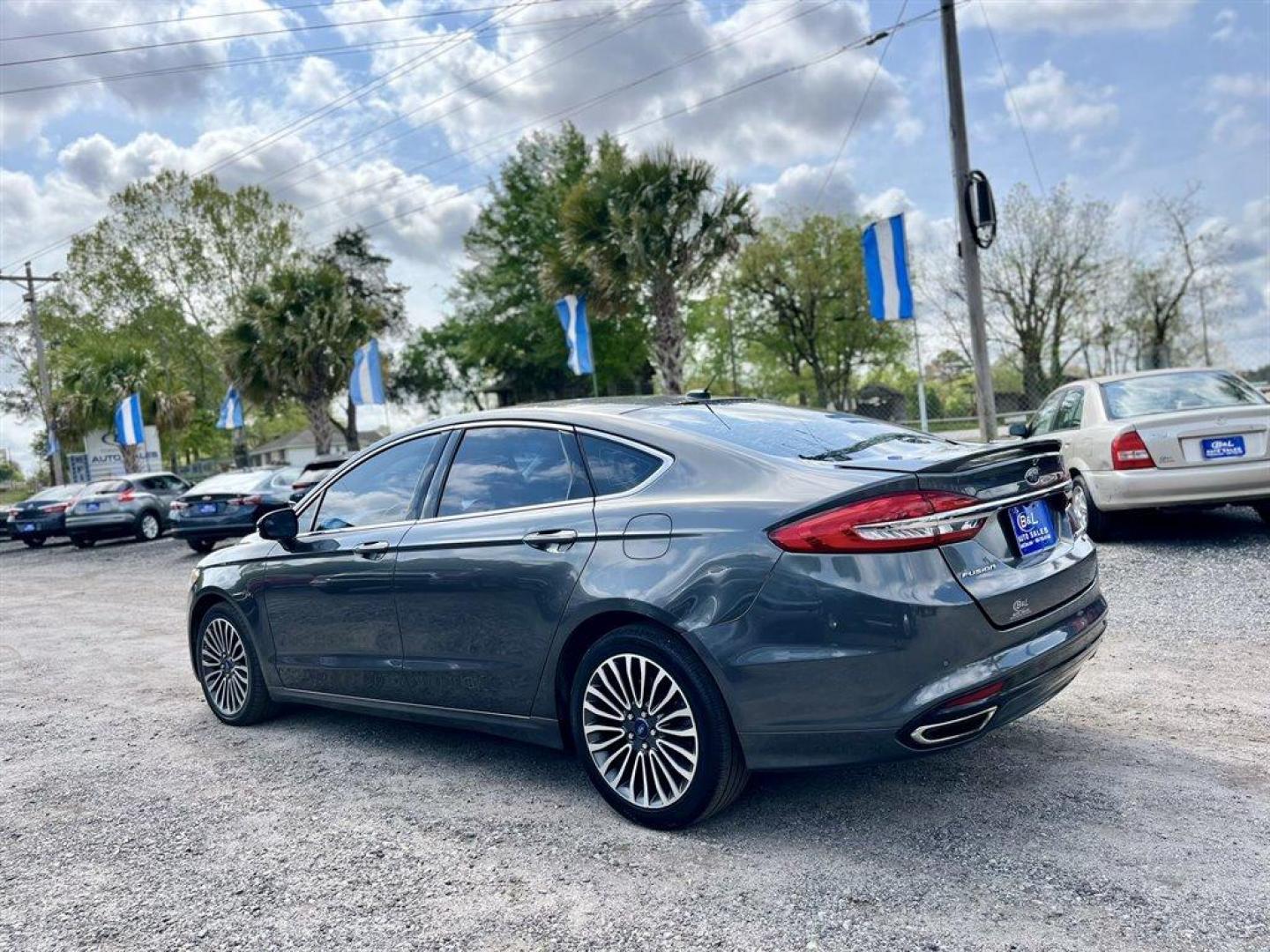 2018 Grey /Black Ford Fusion (3FA6P0D95JR) with an 2.0l I-4 DI T/C Ecoboost engine, Automatic transmission, located at 745 East Steele Rd., West Columbia, SC, 29170, (803) 755-9148, 33.927212, -81.148483 - Special Internet Price! 2018 Ford Fusion with Bluetooth, AM/FM Stereo, Sunroof, Backup camera, Cruise control, Keyless entry, Leather interior, Powered front seats, Powered windows, Powered door locks, Plus more! - Photo#1