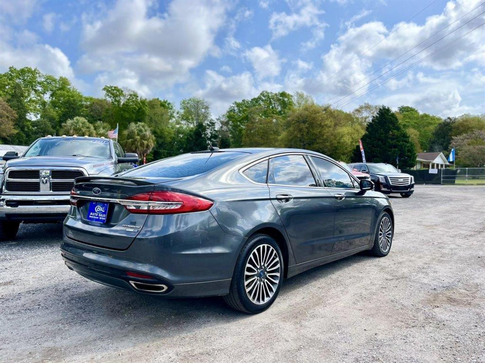 2018 Grey /Black Ford Fusion (3FA6P0D95JR) with an 2.0l I-4 DI T/C Ecoboost engine, Automatic transmission, located at 745 East Steele Rd., West Columbia, SC, 29170, (803) 755-9148, 33.927212, -81.148483 - Special Internet Price! 2018 Ford Fusion with Bluetooth, AM/FM Stereo, Sunroof, Backup camera, Cruise control, Keyless entry, Leather interior, Powered front seats, Powered windows, Powered door locks, Plus more! - Photo #2