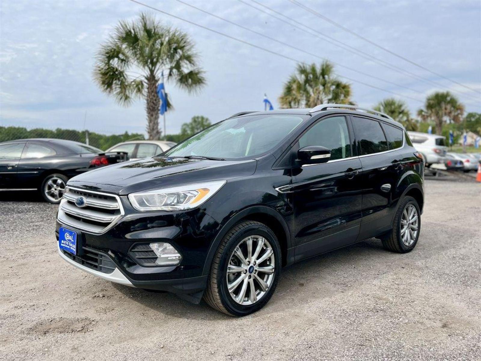 2017 Black /Black Ford Escape (1FMCU9J9XHU) with an 2.0l I-4 DI T/C Ecoboost engine, Automatic transmission, located at 745 East Steele Rd., West Columbia, SC, 29170, (803) 755-9148, 33.927212, -81.148483 - Special Internet Price! 2017 Ford Escape Titanium with Bluetooth, 8 center LCD touch-screen, Backup camera, Navigation, Cruise control, Powered front seats, Leather interior, Heated front seats, Keyless entry, Push to start, Powered liftgate, Powered windows, Powered door locks, Plus more! - Photo #0