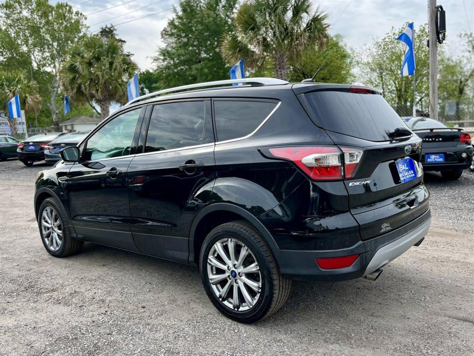 2017 Black /Black Ford Escape (1FMCU9J9XHU) with an 2.0l I-4 DI T/C Ecoboost engine, Automatic transmission, located at 745 East Steele Rd., West Columbia, SC, 29170, (803) 755-9148, 33.927212, -81.148483 - Special Internet Price! 2017 Ford Escape Titanium with Bluetooth, 8 center LCD touch-screen, Backup camera, Navigation, Cruise control, Powered front seats, Leather interior, Heated front seats, Keyless entry, Push to start, Powered liftgate, Powered windows, Powered door locks, Plus more! - Photo #1