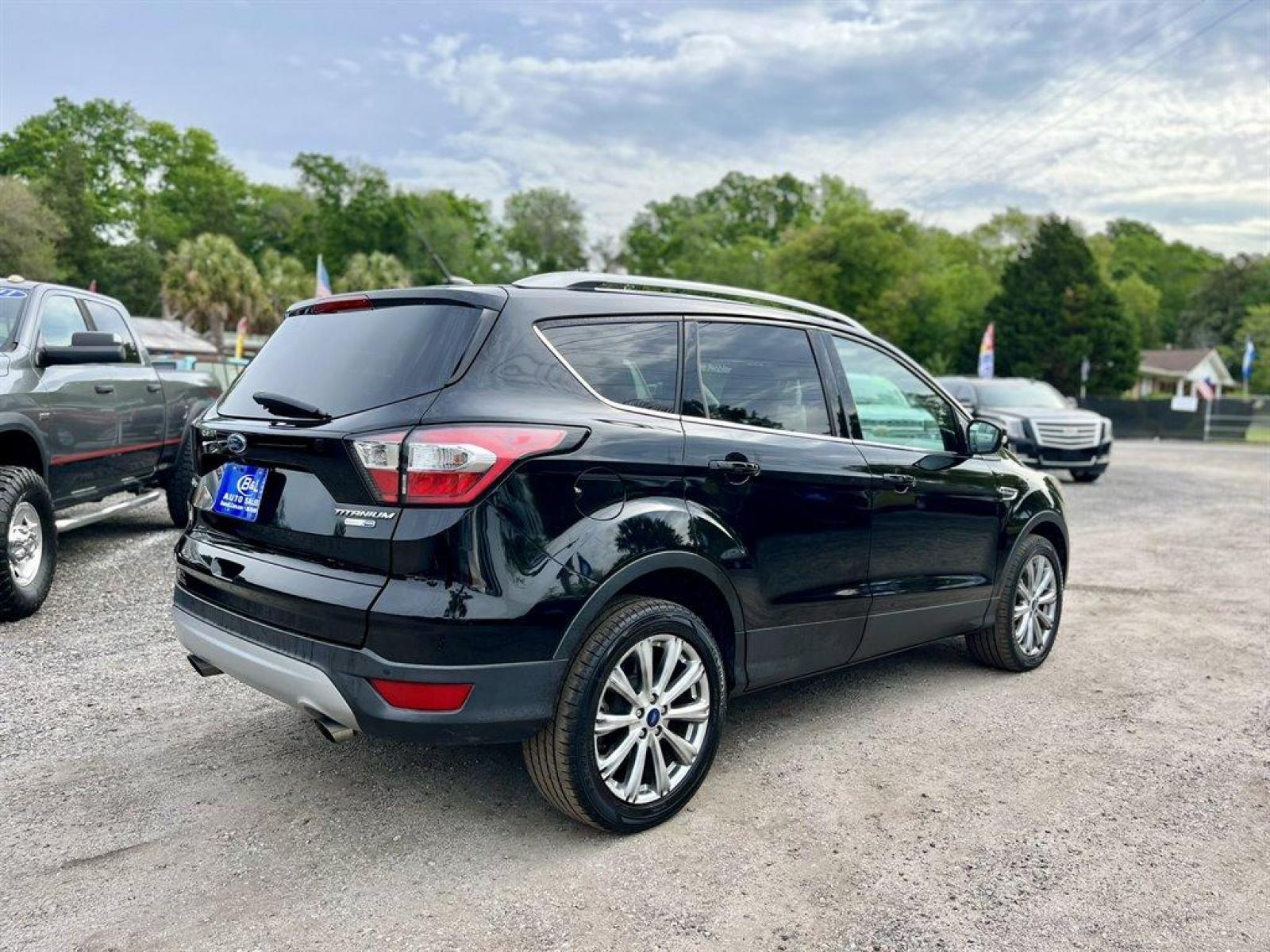 2017 Black /Black Ford Escape (1FMCU9J9XHU) with an 2.0l I-4 DI T/C Ecoboost engine, Automatic transmission, located at 745 East Steele Rd., West Columbia, SC, 29170, (803) 755-9148, 33.927212, -81.148483 - Special Internet Price! 2017 Ford Escape Titanium with Bluetooth, 8 center LCD touch-screen, Backup camera, Navigation, Cruise control, Powered front seats, Leather interior, Heated front seats, Keyless entry, Push to start, Powered liftgate, Powered windows, Powered door locks, Plus more! - Photo #2