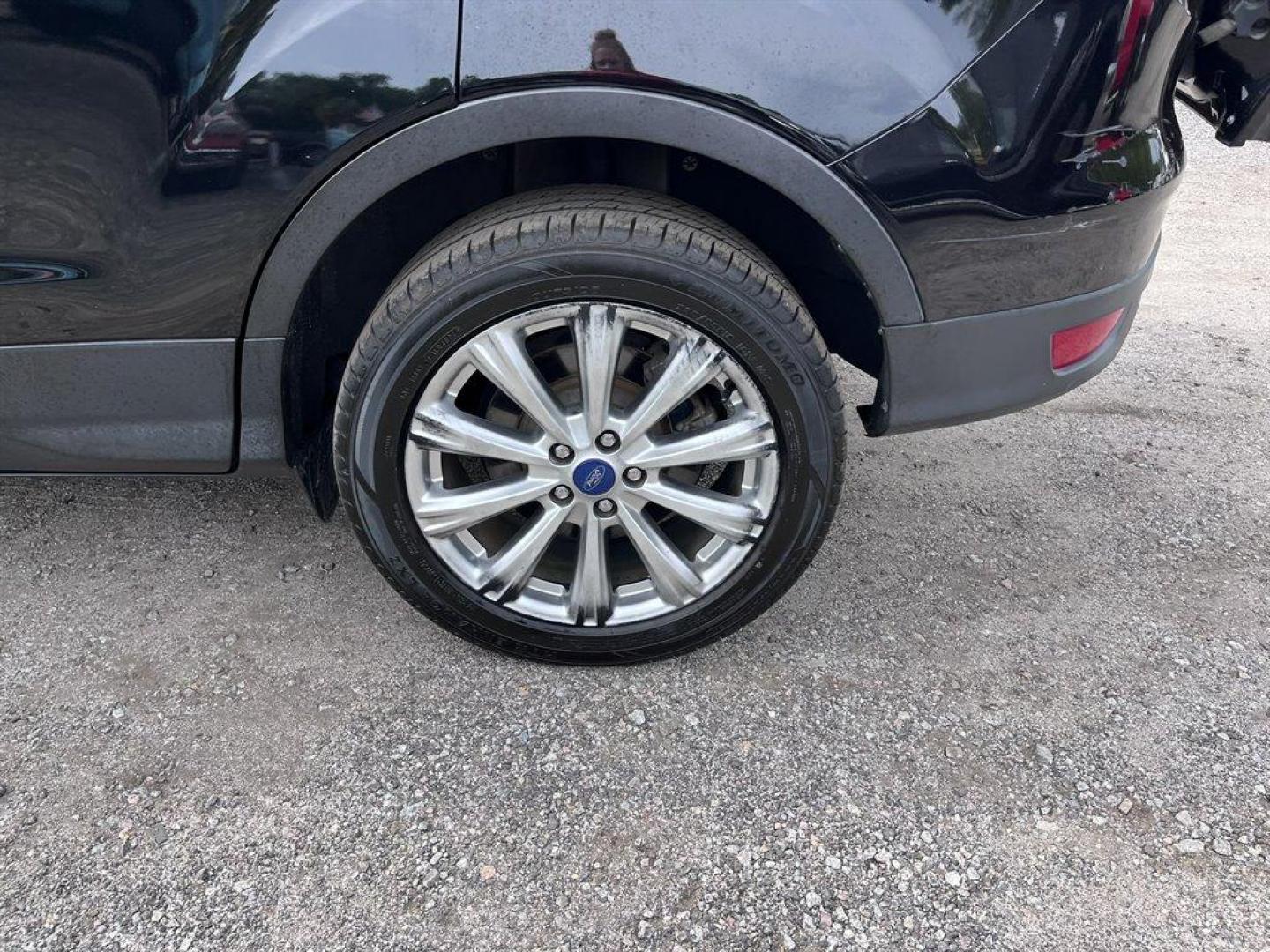 2017 Black /Black Ford Escape (1FMCU9J9XHU) with an 2.0l I-4 DI T/C Ecoboost engine, Automatic transmission, located at 745 East Steele Rd., West Columbia, SC, 29170, (803) 755-9148, 33.927212, -81.148483 - Special Internet Price! 2017 Ford Escape Titanium with Bluetooth, 8 center LCD touch-screen, Backup camera, Navigation, Cruise control, Powered front seats, Leather interior, Heated front seats, Keyless entry, Push to start, Powered liftgate, Powered windows, Powered door locks, Plus more! - Photo#37