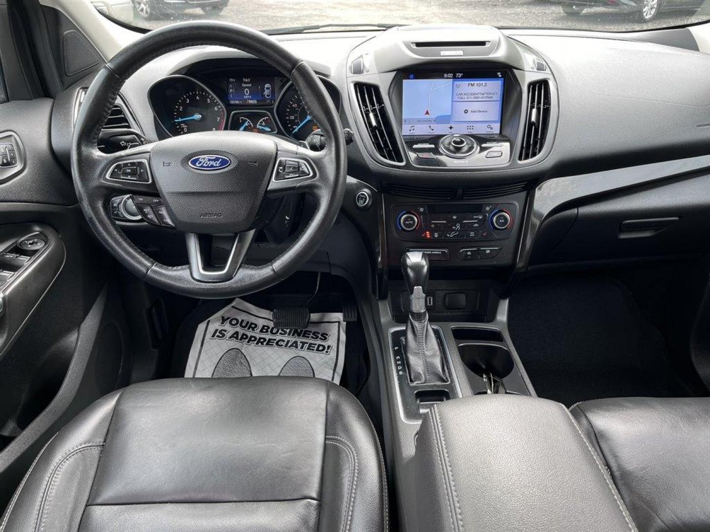 2017 Black /Black Ford Escape (1FMCU9J9XHU) with an 2.0l I-4 DI T/C Ecoboost engine, Automatic transmission, located at 745 East Steele Rd., West Columbia, SC, 29170, (803) 755-9148, 33.927212, -81.148483 - Special Internet Price! 2017 Ford Escape Titanium with Bluetooth, 8 center LCD touch-screen, Backup camera, Navigation, Cruise control, Powered front seats, Leather interior, Heated front seats, Keyless entry, Push to start, Powered liftgate, Powered windows, Powered door locks, Plus more! - Photo#5