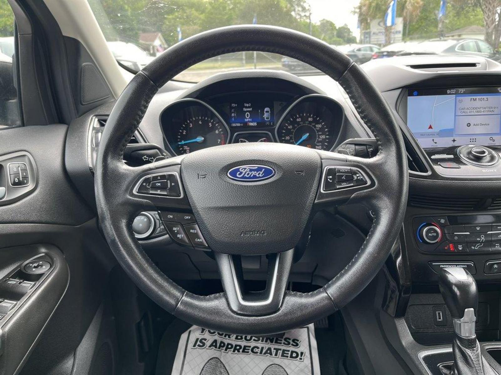 2017 Black /Black Ford Escape (1FMCU9J9XHU) with an 2.0l I-4 DI T/C Ecoboost engine, Automatic transmission, located at 745 East Steele Rd., West Columbia, SC, 29170, (803) 755-9148, 33.927212, -81.148483 - Special Internet Price! 2017 Ford Escape Titanium with Bluetooth, 8 center LCD touch-screen, Backup camera, Navigation, Cruise control, Powered front seats, Leather interior, Heated front seats, Keyless entry, Push to start, Powered liftgate, Powered windows, Powered door locks, Plus more! - Photo #6