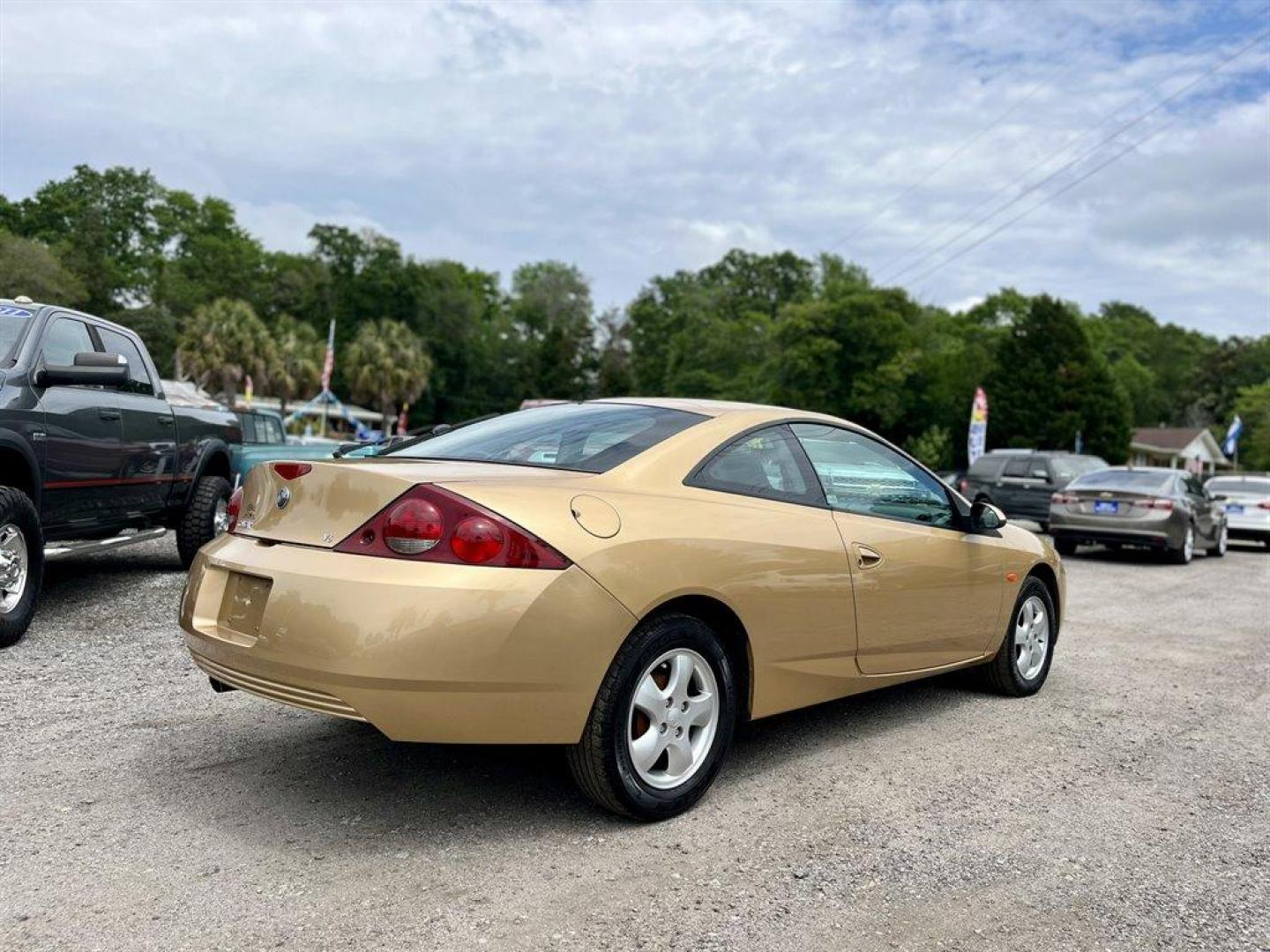 2001 Gold /Grey Mercury Cougar (1ZWFT61L915) with an 2.5l V6 EFI Dohc 2.5l engine, Automatic transmission, located at 745 East Steele Rd., West Columbia, SC, 29170, (803) 755-9148, 33.927212, -81.148483 - Special Internet Price! 2001 Mercury Cougar with AM/FM radio, Cruise control, Cloth interior, Front bucket seats, 50/50 split folding rear seats, Powered windows, Powered door locks, Plus more! - Photo#2