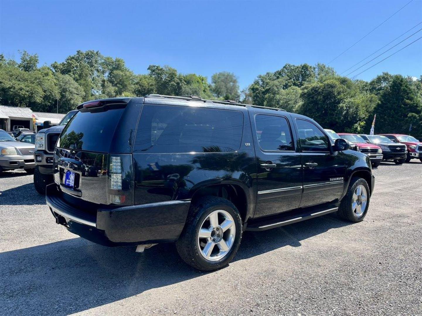 2014 Black /Black Chevrolet Suburban (1GNSKKE71ER) with an 5.3l V8 SFI Flex 5.3l engine, Automatic transmission, located at 745 East Steele Rd., West Columbia, SC, 29170, (803) 755-9148, 33.927212, -81.148483 - Special Internet Price! 2014 Chevrolet Suburban 1500 LTZ with Bluetooth, AM/FM radio, Backup camera, Navigation, Cruise control, Keyless entry, Sunroof, Leather interior, 3rd row seating, Powered driver seat, Duel rear entertainment, Powered liftgate, Powered windows, Powered door locks, Plus more! - Photo#2