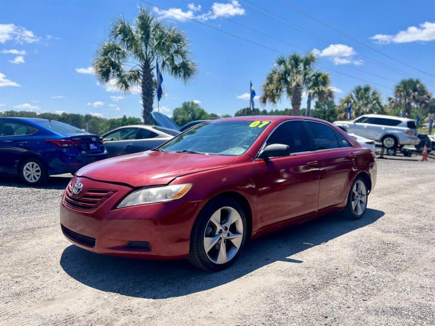 2007 Red /Tan Toyota Camry (JTNBE46K273) with an 2.4l I-4 SFI Dohc 2.4l engine, Automatic transmission, located at 745 East Steele Rd., West Columbia, SC, 29170, (803) 755-9148, 33.927212, -81.148483 - Special Internet Price! 2007 Toyota Camry LE with AM/FM stereo, CD player, Cruise control, Remote keyless entry, Front bucket seats, Rear 60/40 split-folding seats, Powered windows, Powered door locks, Plus more! - Photo#0