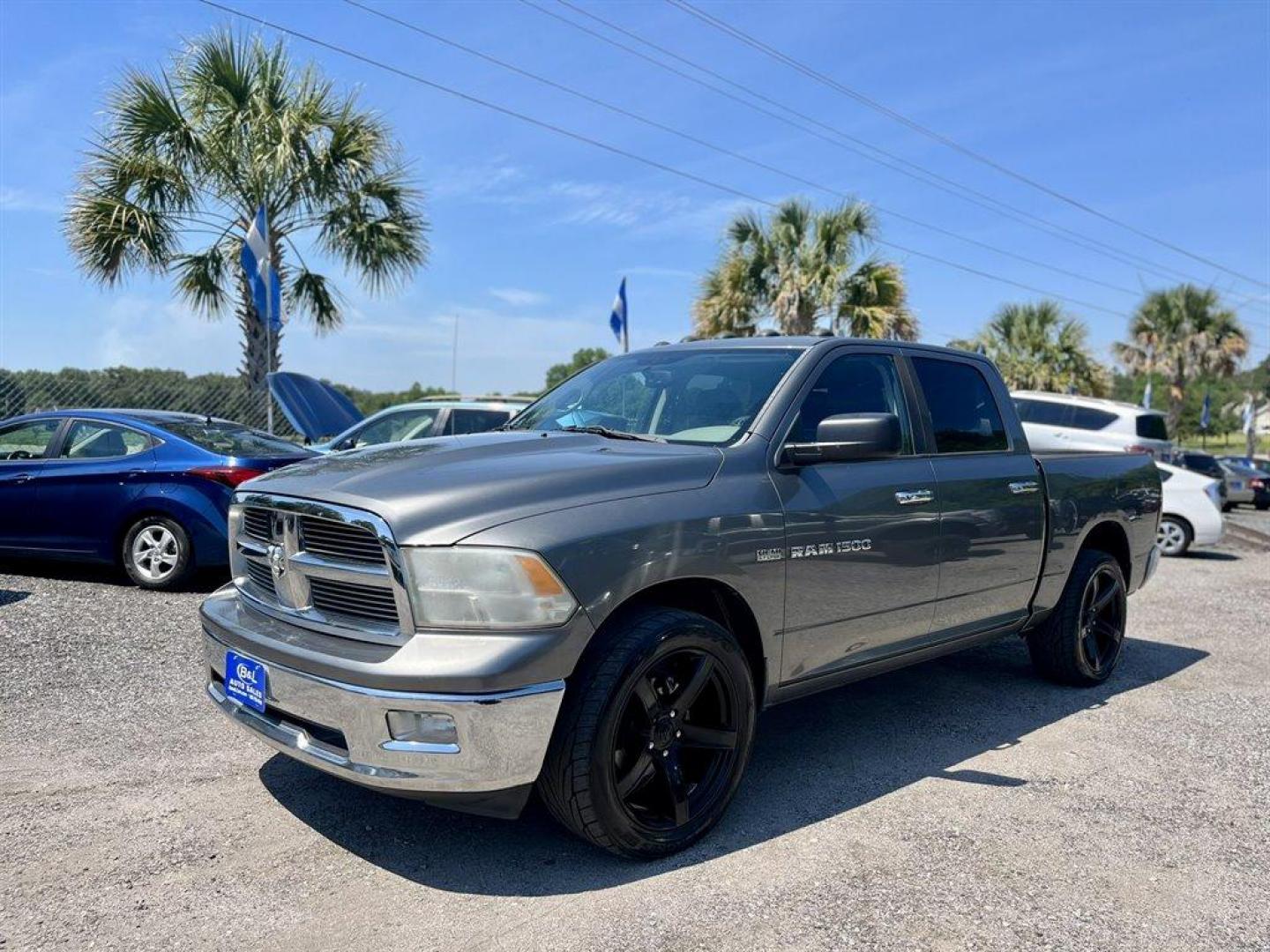 2012 Grey /Grey Ram 1500 (1C6RD6LT4CS) with an 5.7l V8 Smpi Hemi 5.7l engine, Automatic transmission, located at 745 East Steele Rd., West Columbia, SC, 29170, (803) 755-9148, 33.927212, -81.148483 - Special Internet Price! 2012 Ram 1500 SLT with AM/FM radio, Cruise control, Manual air conditioning, Cloth interior, Powered driver seat, Rear split fold up bench seat, Powered windows, Powered door locks, Plus more! - Photo#0