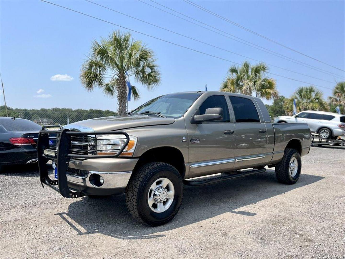 2007 Gold /Tan Dodge RAM 2500 (3D7KS29C87G) with an 5.9l I-6 FI DSL T/C HO 5. engine, Automatic transmission, located at 745 East Steele Rd., West Columbia, SC, 29170, (803) 755-9148, 33.927212, -81.148483 - Special Internet Price! 2007 Dodge RAM 2500 SLT with AM/FM radio, Cruise control, Manual air conditioning, Cloth interior, Powered driver seat, Rear split bench seat, Rear entertainment, Powered windows, Powered door locks, Plus more! - Photo#0