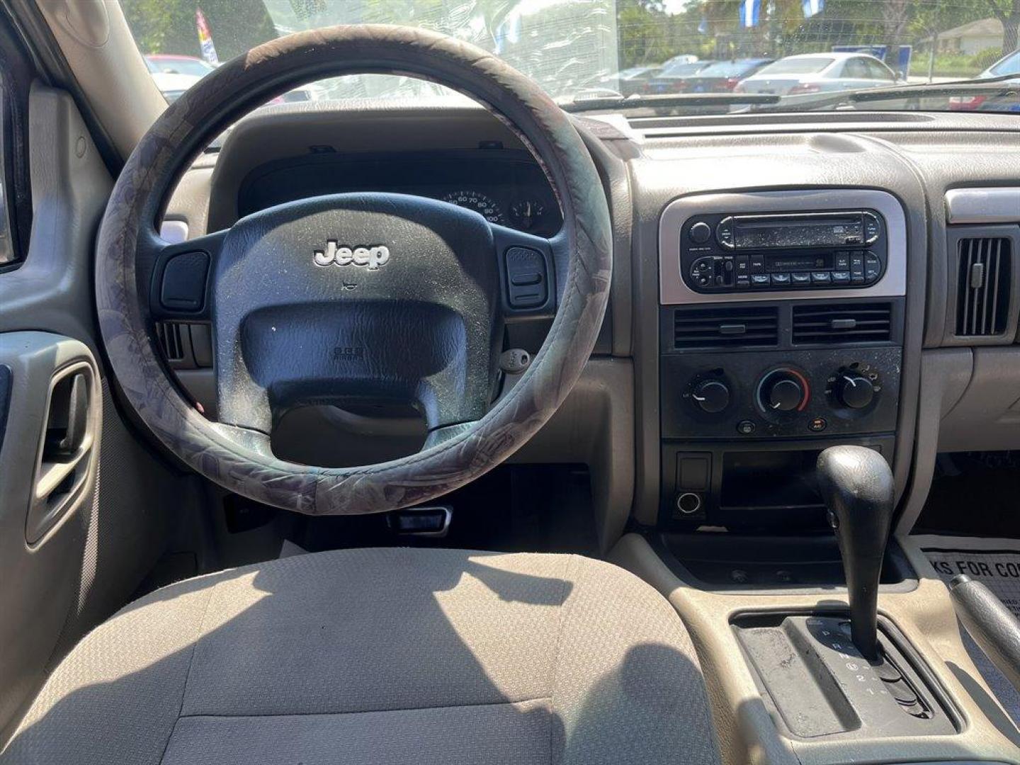 2004 Silver /Grey Jeep Grand Cherokee (1J4GX48S94C) with an 4.0l I-6 MPI 4.0l engine, Automatic transmission, located at 745 East Steele Rd., West Columbia, SC, 29170, (803) 755-9148, 33.927212, -81.148483 - Special Internet Price! 2004 Jeep Grand Cherokee Laredo with AM/FM radio, Cruise control, Manual air conditioning, Powered driver seat, Cloth interior, Rear split bench seat, Powered windows, Powered door locks, Plus more! - Photo#4