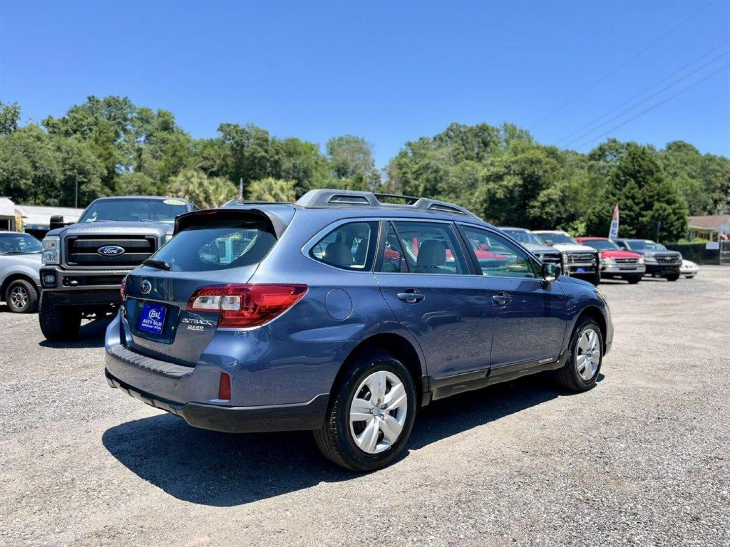 2015 Blue /Tan Subaru Outback (4S4BSAAC7F3) with an 2.5l H-4 MPI Sohc 2.5l engine, Automatic transmission, located at 745 East Steele Rd., West Columbia, SC, 29170, (803) 755-9148, 33.927212, -81.148483 - Special Internet Price! 2015 Subaru Outback Base with AM/FM, Cruise control, Backup camera, Keyless entry, Air conditioning, Cloth interior, Powered windows, Powered door locks, Plus more! - Photo#2