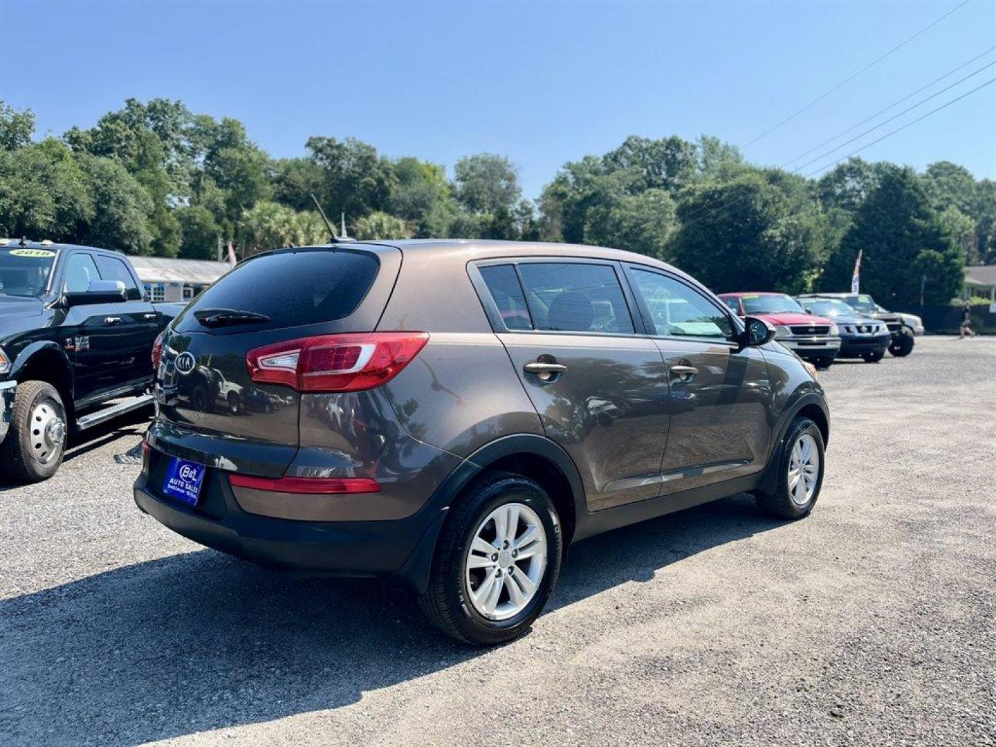 2011 Brown /Grey Kia Sportage (KNDPB3A2XB7) with an 2.4l I-4 MPI Dohc Cvvt 2. engine, Automatic transmission, located at 745 East Steele Rd., West Columbia, SC, 29170, (803) 755-9148, 33.927212, -81.148483 - Special Internet Price! 2011 Kia Sportage Base with AM/FM radio, Cruise control, Manual air conditioning, Cloth interior, Powered windows, Powered door locks, Plus more! - Photo#2