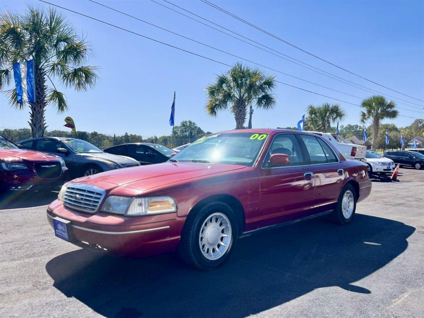 2000 Burgundy /Grey Ford Crown Victoria (2FAFP74W2YX) with an 4.6l V8 EFI Sohc 4.6l engine, Automatic transmission, located at 745 East Steele Rd., West Columbia, SC, 29170, (803) 755-9148, 33.927212, -81.148483 - Special Internet Price! 2000 Ford Crown Victoria LX with AM/FM stereo, Remote keyless entry, Air conditioning, Leather interior, Powered front seats, Powered windows, Powered door locks, Plus more! - Photo#0