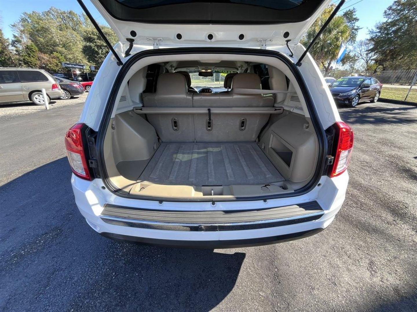 2013 White /Tan Jeep Compass (1C4NJCCB1DD) with an 2.4l I-4 SFI Dohc 2.4l engine, Automatic transmission, located at 745 East Steele Rd., West Columbia, SC, 29170, (803) 755-9148, 33.927212, -81.148483 - Special Internet Price! 2013 Jeep Compass with AM/FM radio, Cruise control, Manual air conditioning, Keyless entry, Powered driver seat, Leather interior, Powered windows, Powered door locks, Plus more! - Photo#30