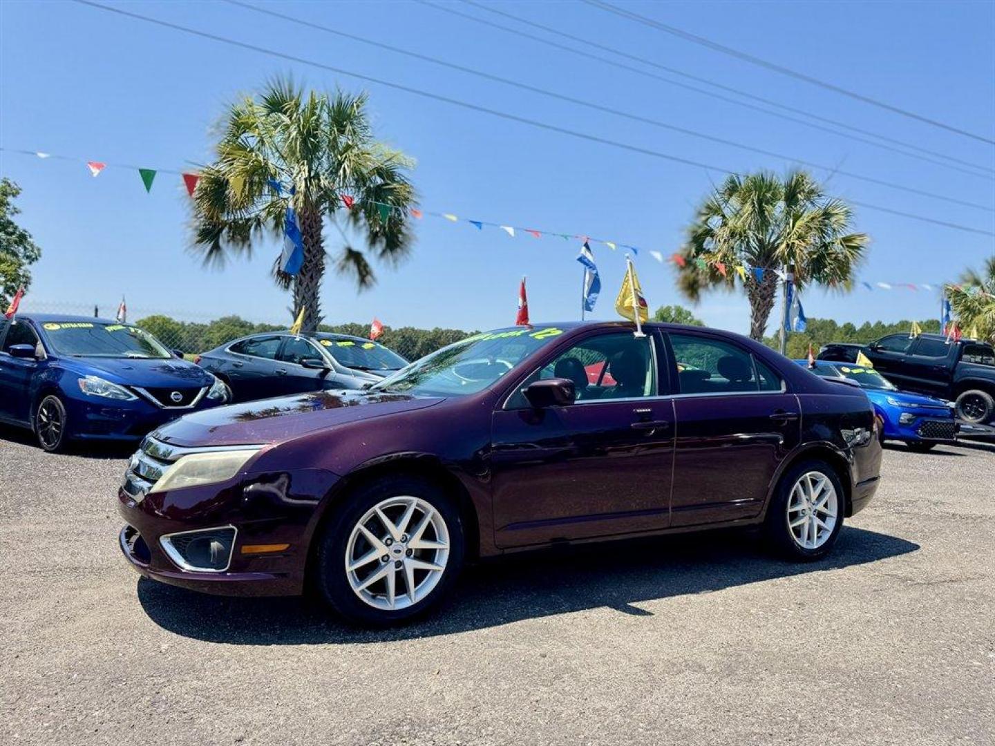 2012 Purple /Black Ford Fusion (3FAHP0JA1CR) with an 2.5l I-4 Smpi Dohc 2.5l engine, Automatic transmission, located at 745 East Steele Rd., West Columbia, SC, 29170, (803) 755-9148, 33.927212, -81.148483 - Special Internet Price! 2012 Ford Fusion with AM/FM radio, Cruise control, Backup camera, Sunroof, Leather interior, Powered front seats, Powered windows, Powered door locks, Plus more! - Photo#0