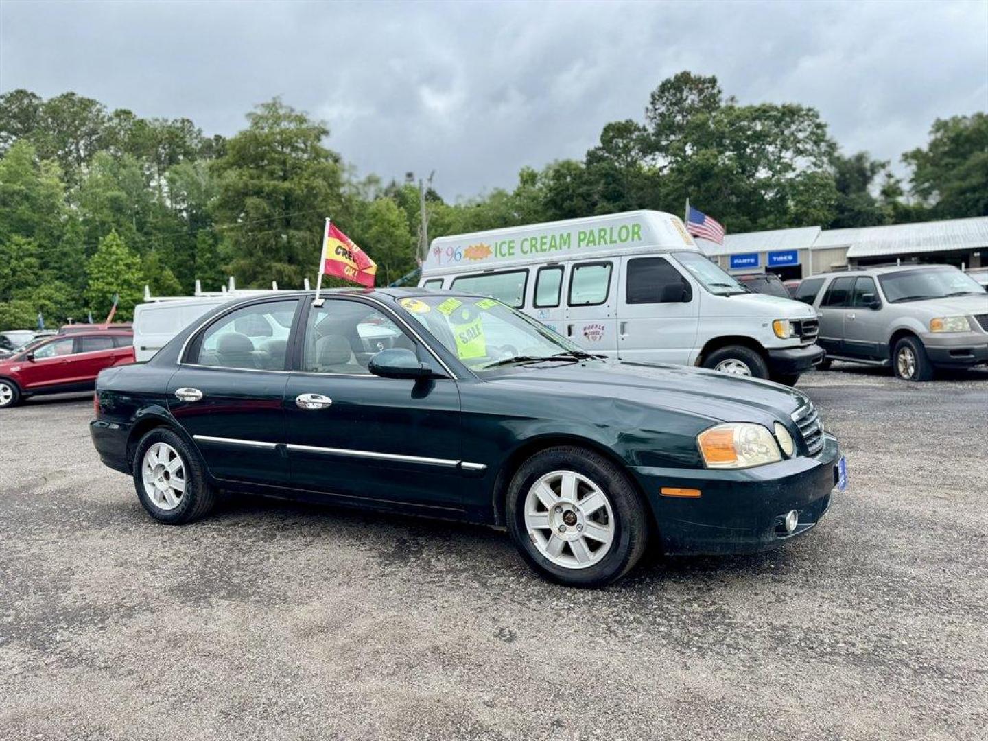 2004 Black /Grey Kia Optima (KNAGD126045) with an 2.4l I-4 MPI Dohc 2.4l engine, Automatic transmission, located at 745 East Steele Rd., West Columbia, SC, 29170, (803) 755-9148, 33.927212, -81.148483 - Special Internet Price! 2004 Kia Optima with AM/FM radio, Cruise control, Sunroof, Cloth interior, Powered windows, Powered door locks, Plus more! - Photo#2