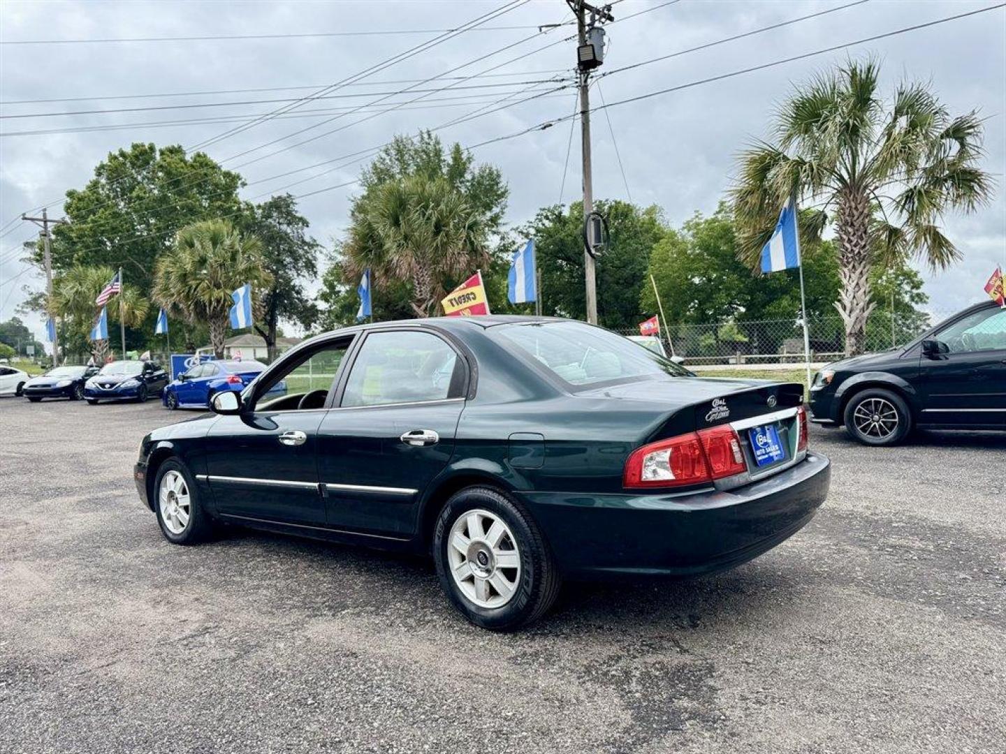 2004 Black /Grey Kia Optima (KNAGD126045) with an 2.4l I-4 MPI Dohc 2.4l engine, Automatic transmission, located at 745 East Steele Rd., West Columbia, SC, 29170, (803) 755-9148, 33.927212, -81.148483 - Special Internet Price! 2004 Kia Optima with AM/FM radio, Cruise control, Sunroof, Cloth interior, Powered windows, Powered door locks, Plus more! - Photo#5