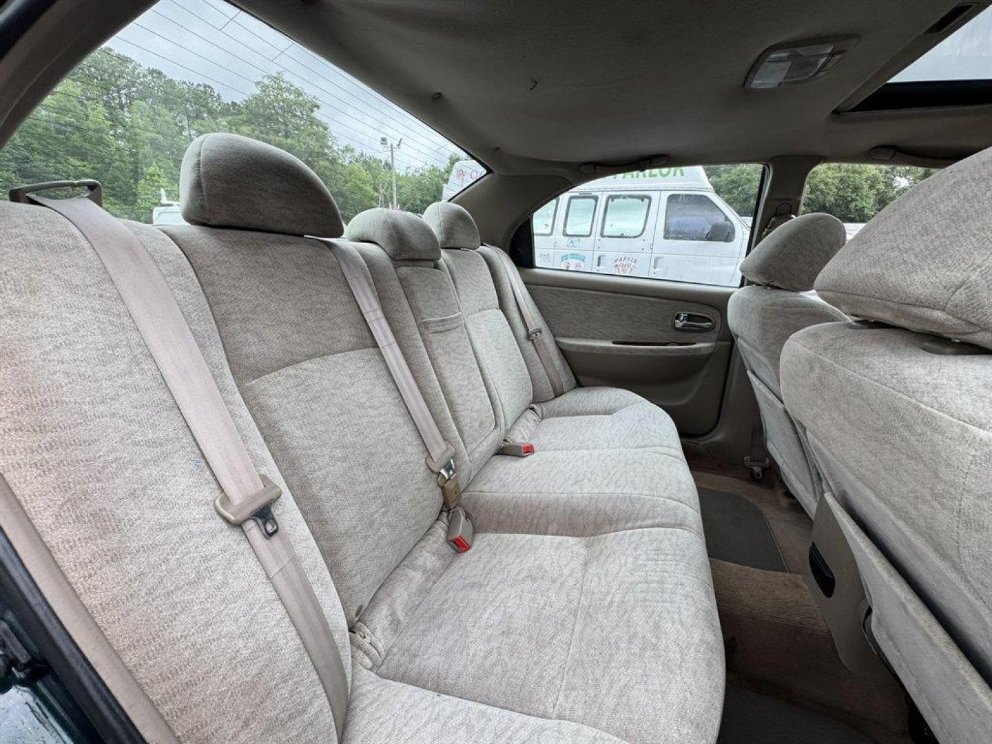 2004 Black /Grey Kia Optima (KNAGD126045) with an 2.4l I-4 MPI Dohc 2.4l engine, Automatic transmission, located at 745 East Steele Rd., West Columbia, SC, 29170, (803) 755-9148, 33.927212, -81.148483 - Special Internet Price! 2004 Kia Optima with AM/FM radio, Cruise control, Sunroof, Cloth interior, Powered windows, Powered door locks, Plus more! - Photo#26