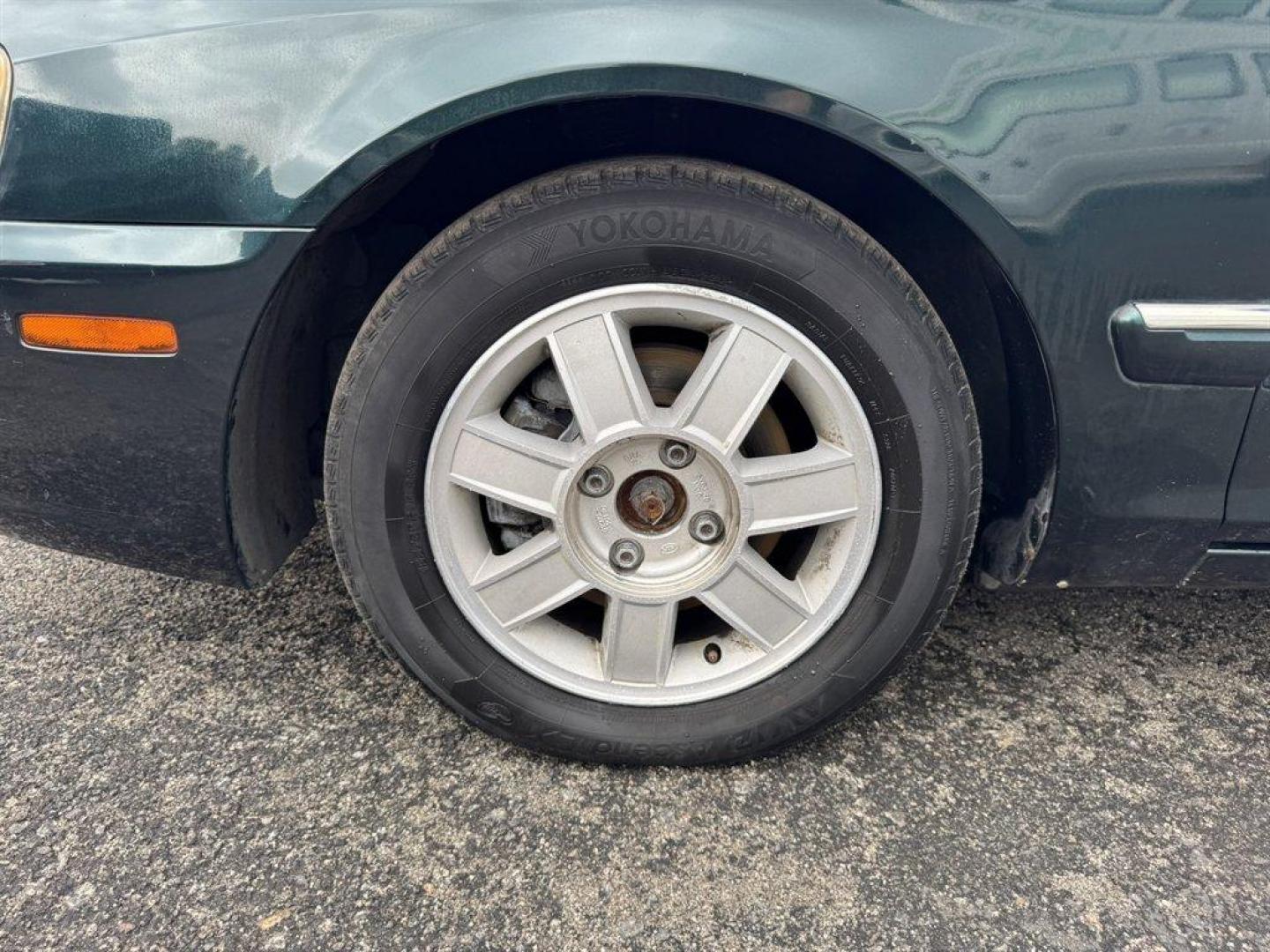 2004 Black /Grey Kia Optima (KNAGD126045) with an 2.4l I-4 MPI Dohc 2.4l engine, Automatic transmission, located at 745 East Steele Rd., West Columbia, SC, 29170, (803) 755-9148, 33.927212, -81.148483 - Special Internet Price! 2004 Kia Optima with AM/FM radio, Cruise control, Sunroof, Cloth interior, Powered windows, Powered door locks, Plus more! - Photo#33