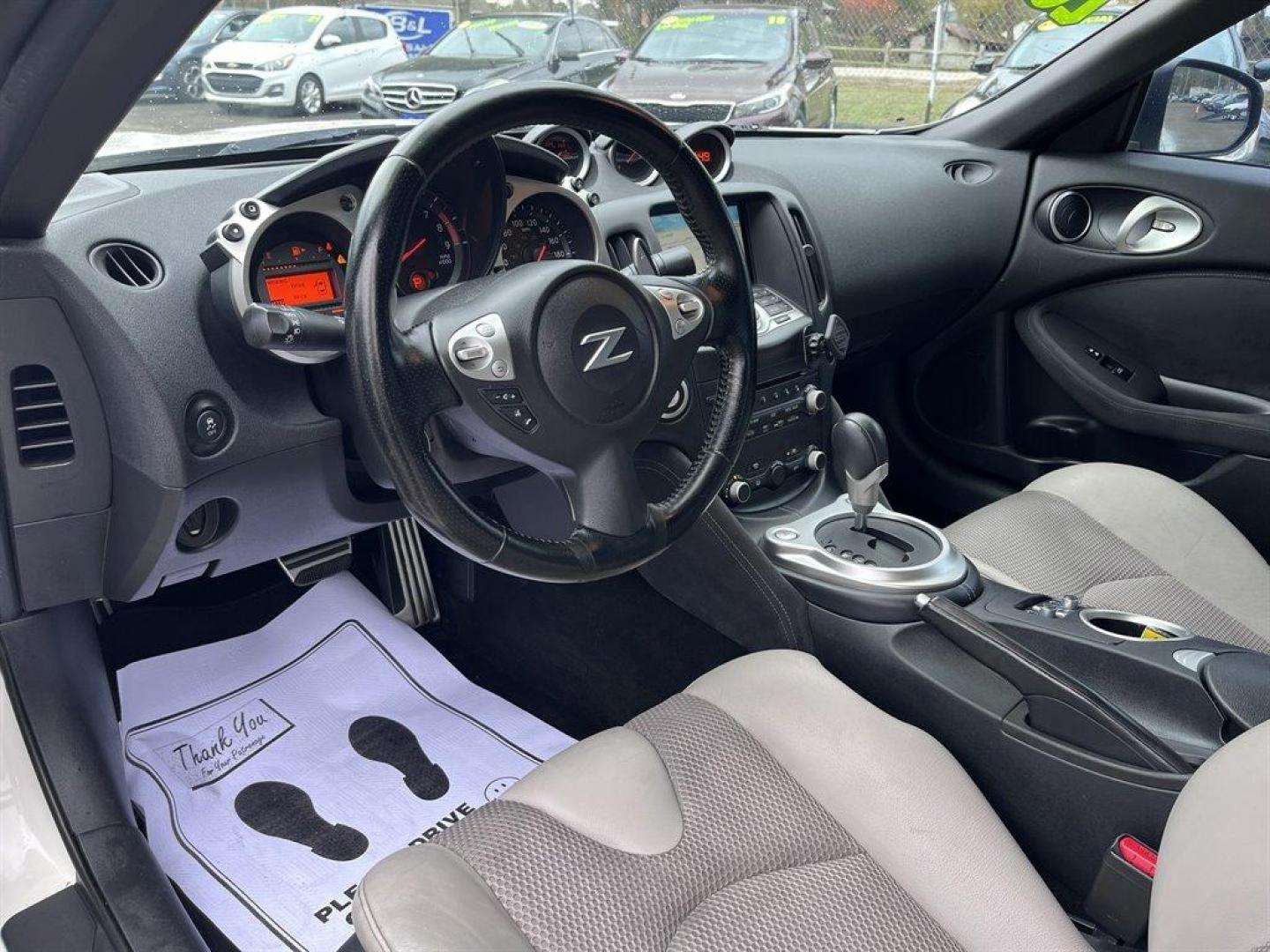 2015 White /Grey Nissan 370z (JN1AZ4FH6FM) with an 3.7l V6 SFI Dohc Cvtcs 3. engine, Automatic transmission, located at 745 East Steele Rd., West Columbia, SC, 29170, (803) 755-9148, 33.927212, -81.148483 - Special Internet Price! 2015 Nissan 370z with convertible top, AM/FM radio, Cruise control, Heated seats, Backup camera, Keyless entry, Powered windows, Powered door locks, Plus more! - Photo#8