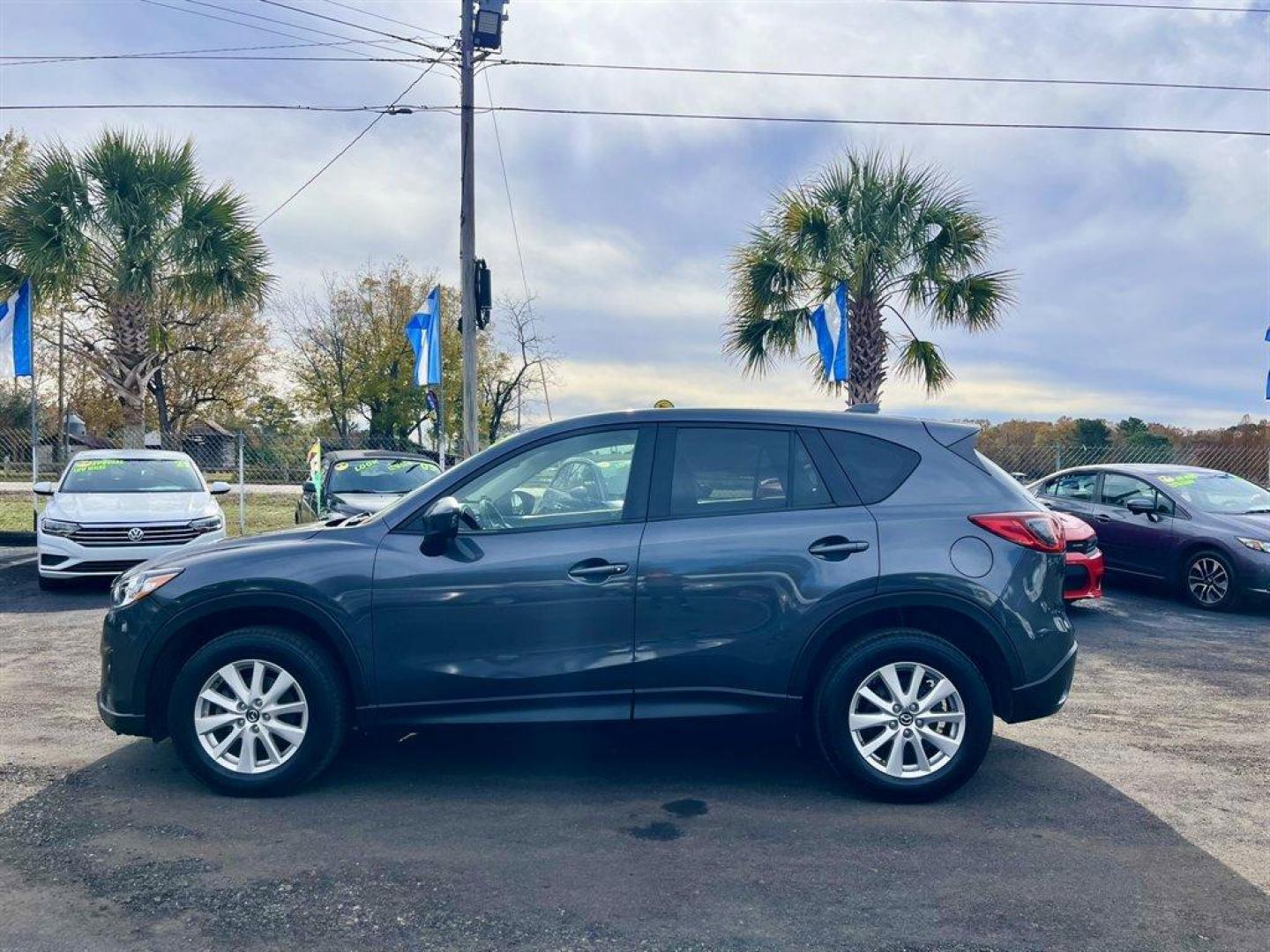 2014 Grey /Black Mazda CX-5 (JM3KE4CY6E0) with an 2.5l I-4 DI Dohc 2.5l engine, Automatic transmission, located at 745 East Steele Rd., West Columbia, SC, 29170, (803) 755-9148, 33.927212, -81.148483 - Special Internet Price! 2014 Mazda CX-5 with AM/FM radio, Bluetooth, Backup camera, Navigation, Sunroof, Manual air conditioning, Cloth interior, Powered driver seat, Keyless entry, Powered door locks, Powered windows, Plus more! - Photo#1