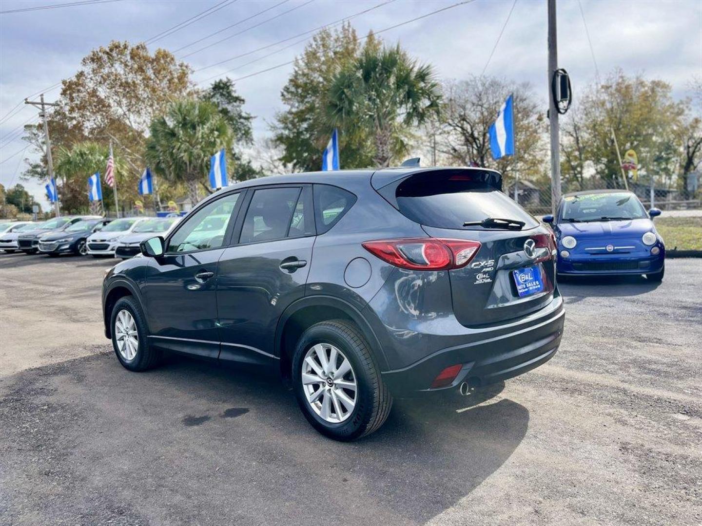 2014 Grey /Black Mazda CX-5 (JM3KE4CY6E0) with an 2.5l I-4 DI Dohc 2.5l engine, Automatic transmission, located at 745 East Steele Rd., West Columbia, SC, 29170, (803) 755-9148, 33.927212, -81.148483 - Special Internet Price! 2014 Mazda CX-5 with AM/FM radio, Bluetooth, Backup camera, Navigation, Sunroof, Manual air conditioning, Cloth interior, Powered driver seat, Keyless entry, Powered door locks, Powered windows, Plus more! - Photo#2