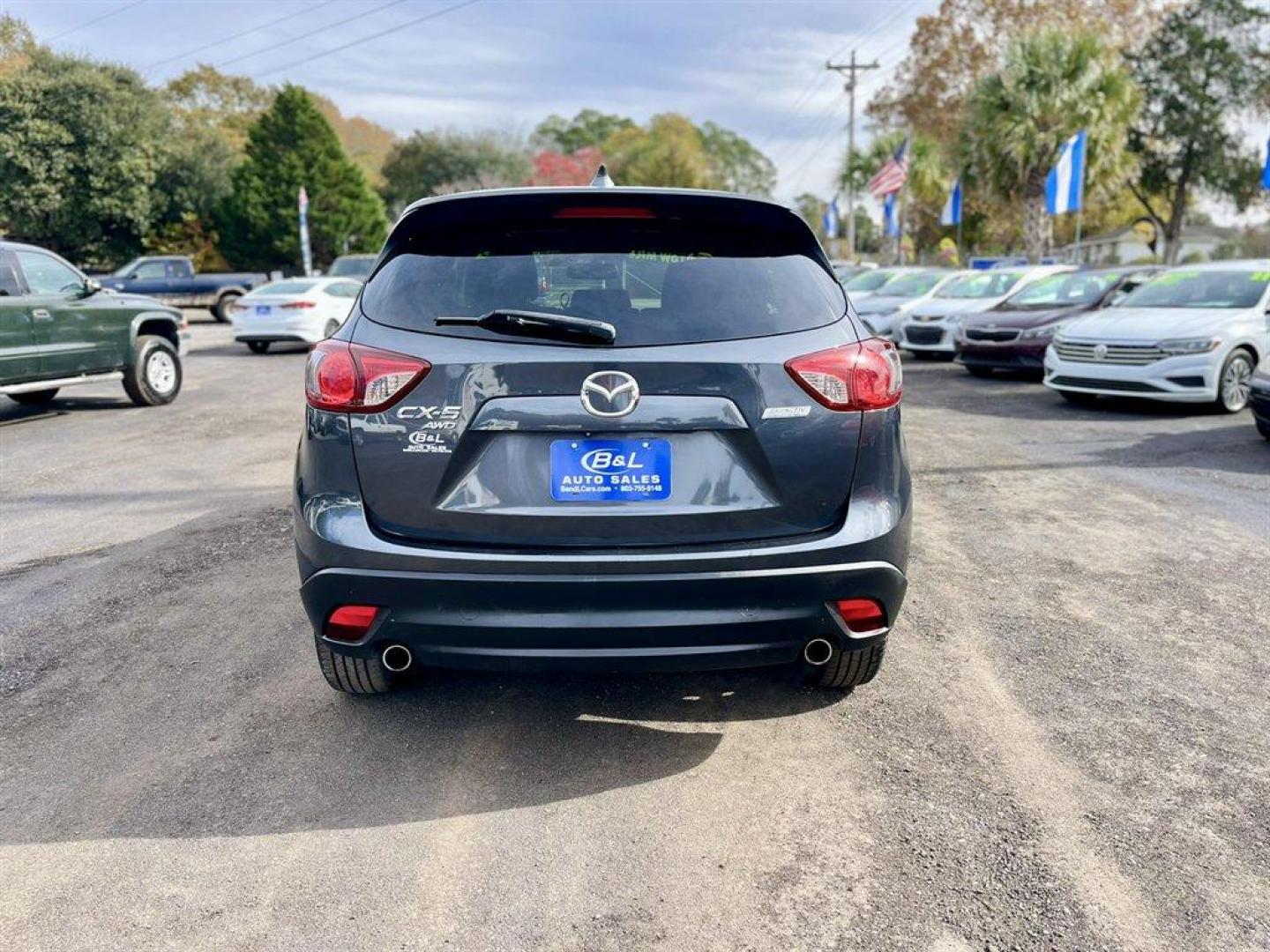 2014 Grey /Black Mazda CX-5 (JM3KE4CY6E0) with an 2.5l I-4 DI Dohc 2.5l engine, Automatic transmission, located at 745 East Steele Rd., West Columbia, SC, 29170, (803) 755-9148, 33.927212, -81.148483 - Special Internet Price! 2014 Mazda CX-5 with AM/FM radio, Bluetooth, Backup camera, Navigation, Sunroof, Manual air conditioning, Cloth interior, Powered driver seat, Keyless entry, Powered door locks, Powered windows, Plus more! - Photo#3