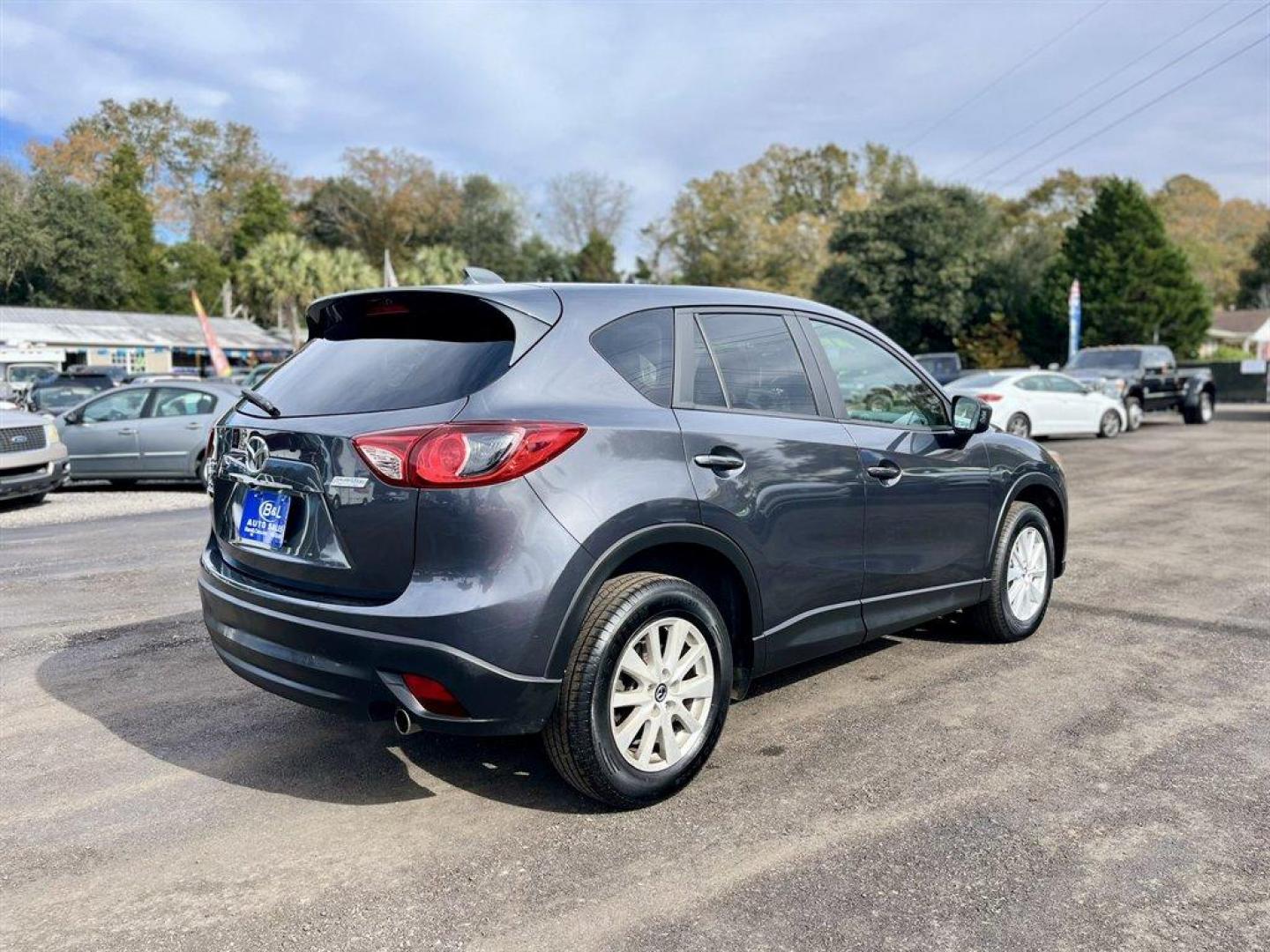 2014 Grey /Black Mazda CX-5 (JM3KE4CY6E0) with an 2.5l I-4 DI Dohc 2.5l engine, Automatic transmission, located at 745 East Steele Rd., West Columbia, SC, 29170, (803) 755-9148, 33.927212, -81.148483 - Special Internet Price! 2014 Mazda CX-5 with AM/FM radio, Bluetooth, Backup camera, Navigation, Sunroof, Manual air conditioning, Cloth interior, Powered driver seat, Keyless entry, Powered door locks, Powered windows, Plus more! - Photo#4