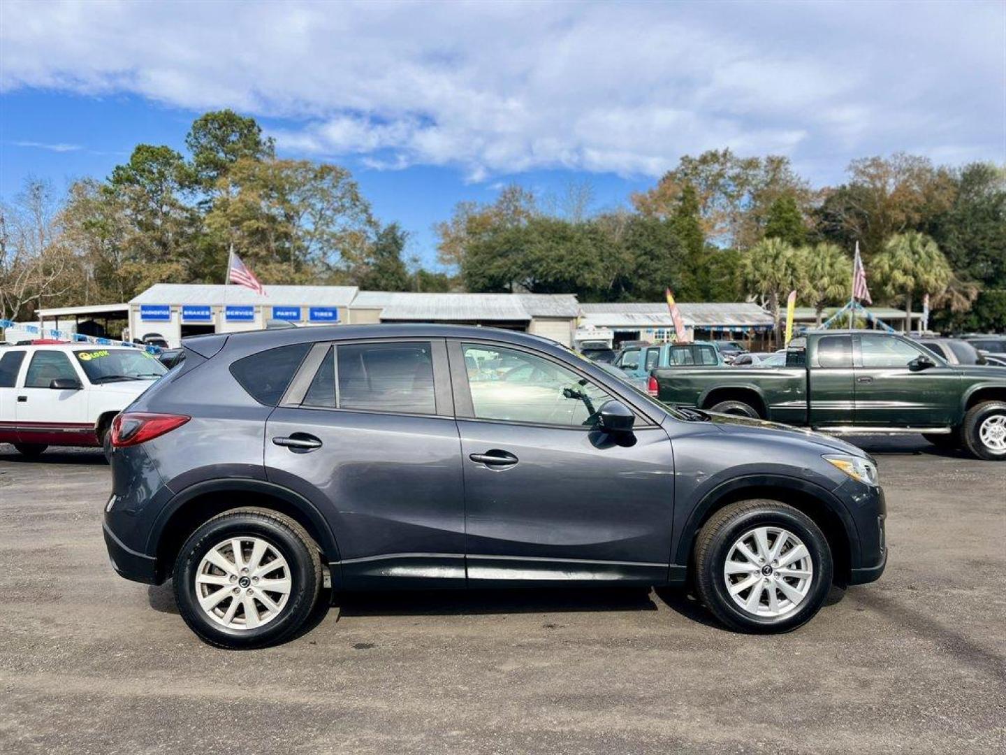 2014 Grey /Black Mazda CX-5 (JM3KE4CY6E0) with an 2.5l I-4 DI Dohc 2.5l engine, Automatic transmission, located at 745 East Steele Rd., West Columbia, SC, 29170, (803) 755-9148, 33.927212, -81.148483 - Special Internet Price! 2014 Mazda CX-5 with AM/FM radio, Bluetooth, Backup camera, Navigation, Sunroof, Manual air conditioning, Cloth interior, Powered driver seat, Keyless entry, Powered door locks, Powered windows, Plus more! - Photo#5