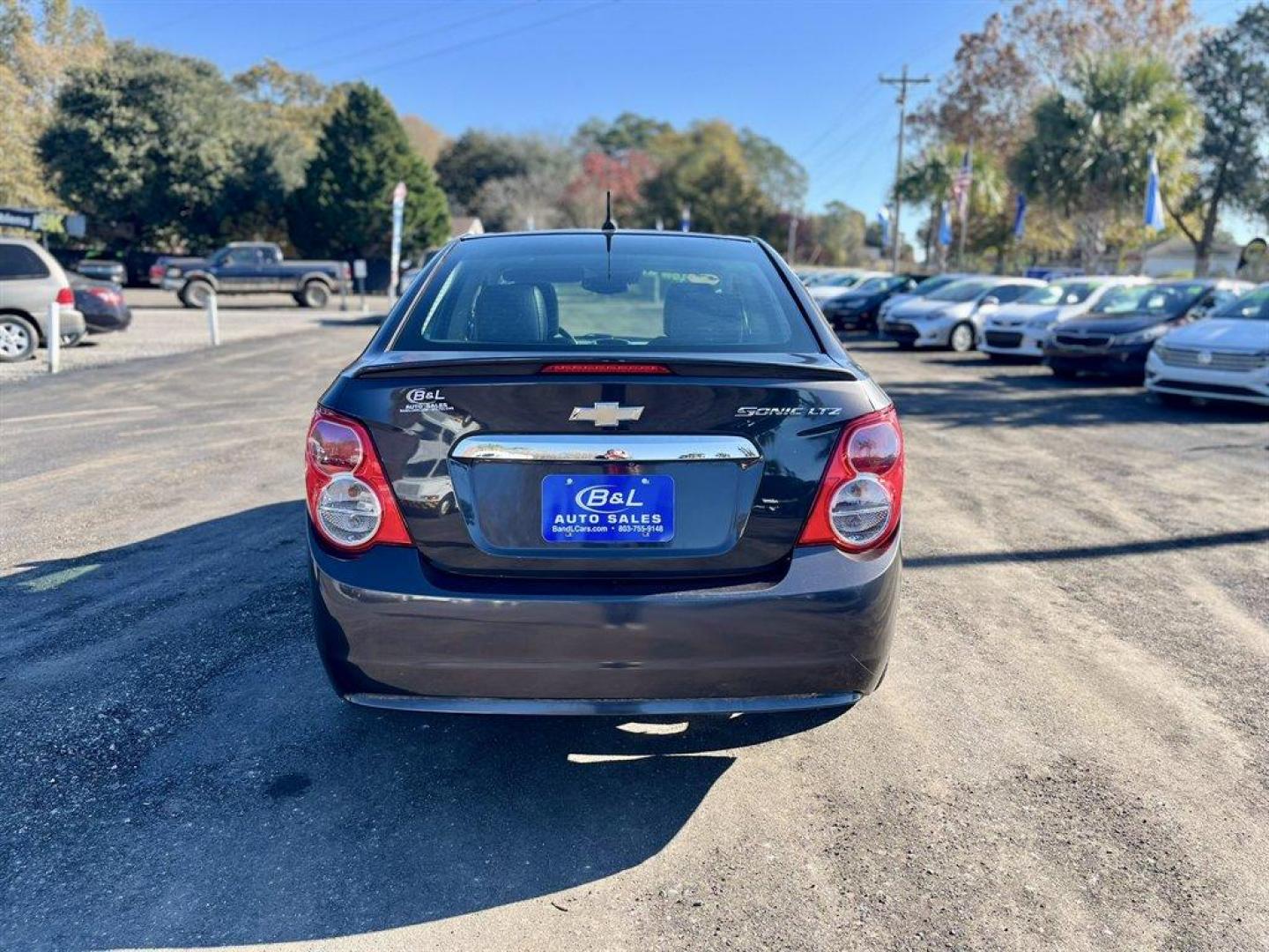 2014 Brown /Black Chevrolet Sonic (1G1JE5SH6E4) with an 1.8l I-4 MFI Dohc Flex 1. engine, Automatic transmission, located at 745 East Steele Rd., West Columbia, SC, 29170, (803) 755-9148, 33.927212, -81.148483 - Special Internet Price! 2014 Chevrolet Sonic with AM/FM radio, Cruise control, Manual air conditioning, Backup camera, Powered windows, Powered door locks, Plus more! - Photo#3