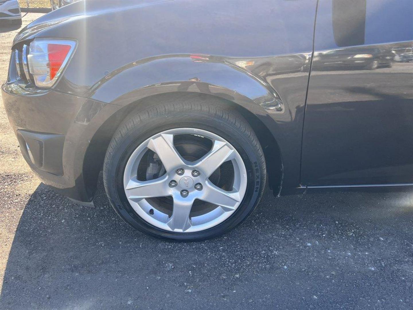 2014 Brown /Black Chevrolet Sonic (1G1JE5SH6E4) with an 1.8l I-4 MFI Dohc Flex 1. engine, Automatic transmission, located at 745 East Steele Rd., West Columbia, SC, 29170, (803) 755-9148, 33.927212, -81.148483 - Special Internet Price! 2014 Chevrolet Sonic with AM/FM radio, Cruise control, Manual air conditioning, Backup camera, Powered windows, Powered door locks, Plus more! - Photo#35