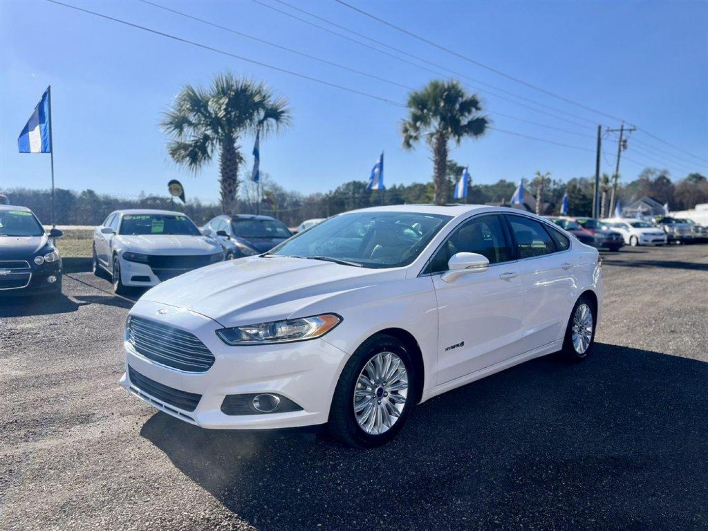 2016 White /Taupe Ford Fusion (3FA6P0LU5GR) with an 2.0l I-4 Smpi Dohc Hybrid engine, Automatic transmission, located at 745 East Steele Rd., West Columbia, SC, 29170, (803) 755-9148, 33.927212, -81.148483 - Special Internet Price! 2016 Ford Fusion SE Hybrid - Photo#0