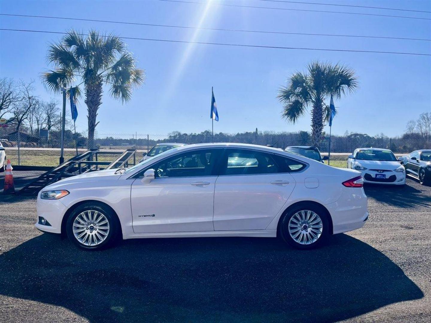 2016 White /Taupe Ford Fusion (3FA6P0LU5GR) with an 2.0l I-4 Smpi Dohc Hybrid engine, Automatic transmission, located at 745 East Steele Rd., West Columbia, SC, 29170, (803) 755-9148, 33.927212, -81.148483 - Special Internet Price! 2016 Ford Fusion SE Hybrid - Photo#2