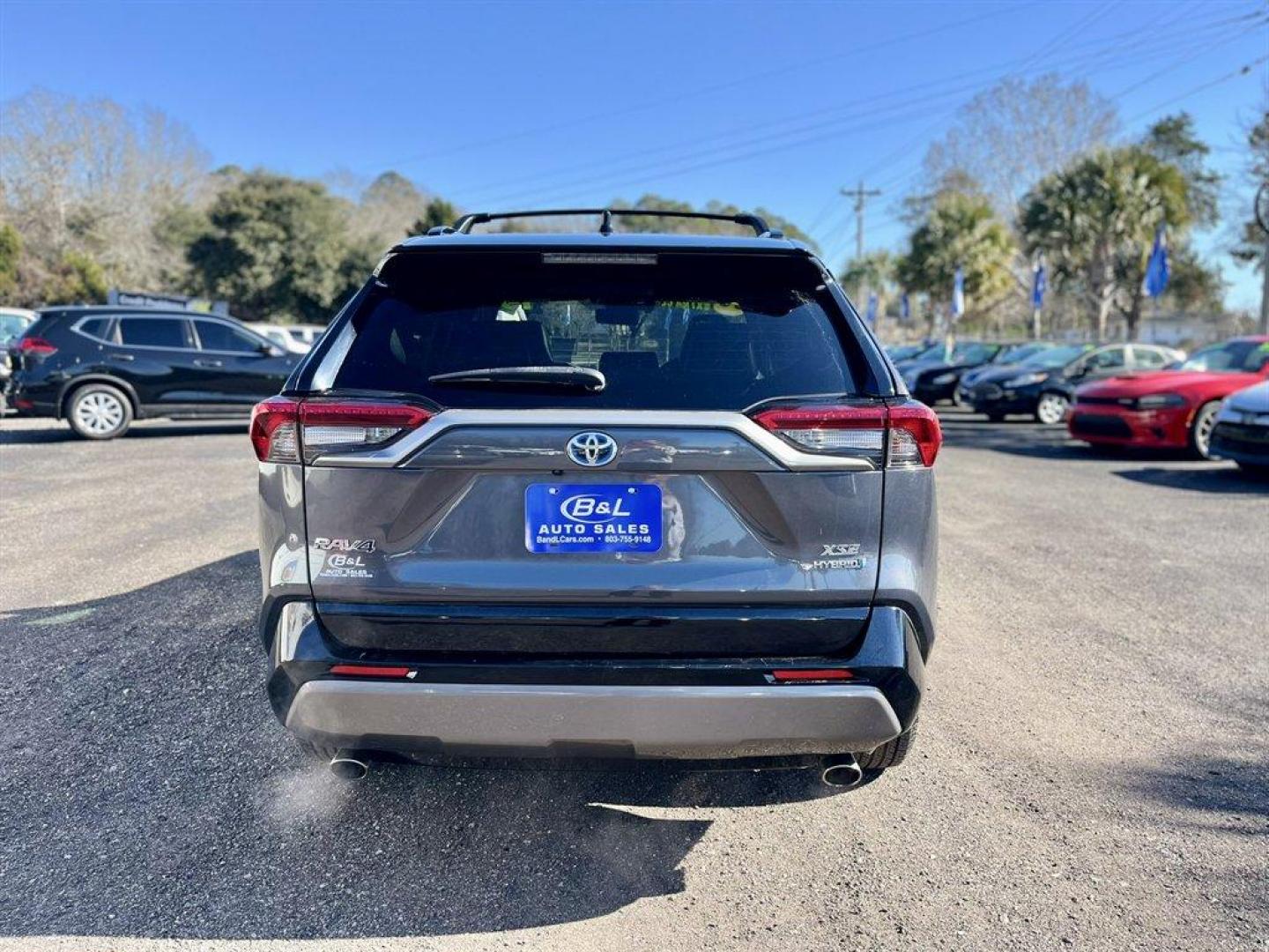 2019 Grey /Black Toyota RAV4 (2T3EWRFV7KW) with an 2.5l I-4 EFI Dohc Hybrid engine, Automatic transmission, located at 745 East Steele Rd., West Columbia, SC, 29170, (803) 755-9148, 33.927212, -81.148483 - Special Internet Price! 2019 Toyota RAV4 with AM/FM radio, Bluetooth, Backup camera, Navigation, Sunroof, Luggage rack, Push to start, Keyless entry, Leather interior, Heated front seats, Powered driver seat, Powered windows, Powered door locks, Plus more! - Photo#4