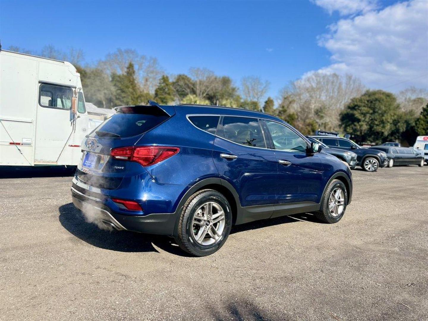 2017 Blue /Taupe Hyundai Santa FE Sport (5XYZU3LB8HG) with an 2.4l I-4 DI Dohc 2.4l engine, Automatic transmission, located at 745 East Steele Rd., West Columbia, SC, 29170, (803) 755-9148, 33.927212, -81.148483 - Special Internet Price! 2017 Hyundai Santa Fe Sport with AM/FM radio, Bluetooth, Backup camera, Navigation, Cruise control, Panoramic sunroof, Push to start, Keyless entry, Leather interior, Heated seats, Powered front seats, Built in rear sun shades, Powered windows, Powered door locks, Plus more! - Photo#3