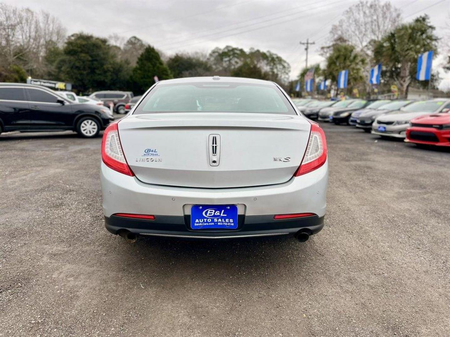 2013 Silver /Black Lincoln MKS (1LNHL9DK1DG) with an 3.7l V6 Smpi TI-VCT 3.7l engine, Automatic transmission, located at 745 East Steele Rd., West Columbia, SC, 29170, (803) 755-9148, 33.927212, -81.148483 - Special Internet Price! 2013 Lincoln MKS with AM/FM radio, Bluetooth, Backup camera. Navigation, Cruise control, Keyless entry, Push to start, Dual sunroof, Leather interior, Powered front seats, Powered windows, Powered door locks, Plus more! - Photo#2