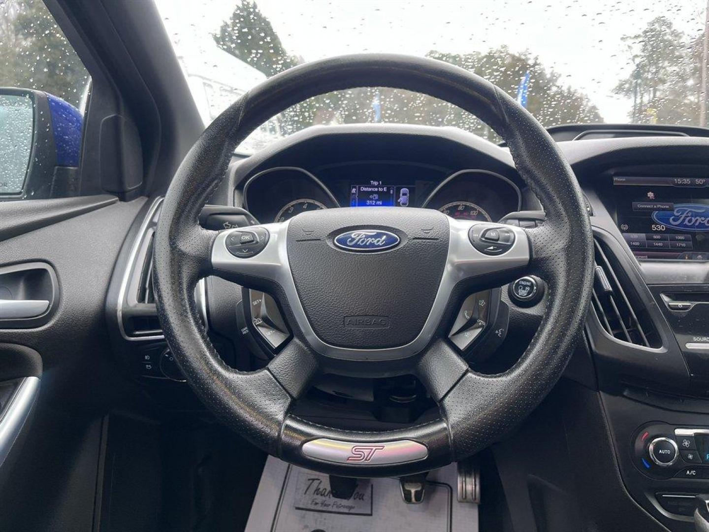 2013 Blue /Black Ford Focus (1FADP3L93DL) with an 2.0l I-4 DI T/C Ecoboost engine, Manual transmission, located at 745 East Steele Rd., West Columbia, SC, 29170, (803) 755-9148, 33.927212, -81.148483 - Special Internet Price! 2013 Ford Focus with AM/FM radio, Bluetooth, Navigation, Cruise control, Sunroof, Push to start, Keyless entry, Manual transmission, Powered windows, Powered door locks, Plus more! - Photo#7