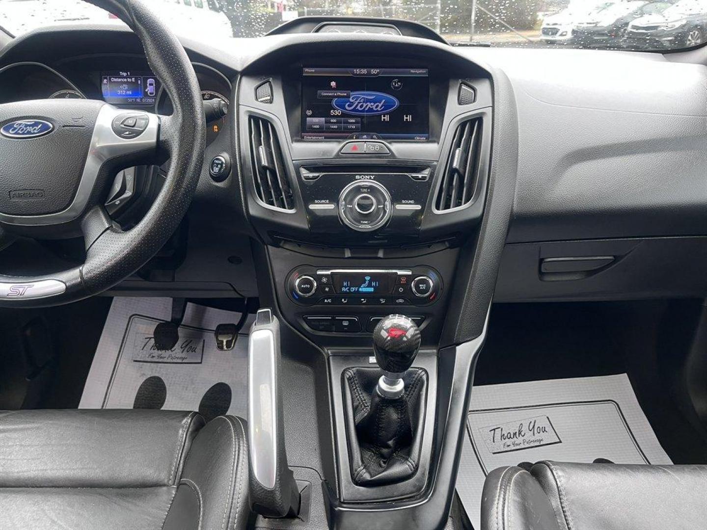 2013 Blue /Black Ford Focus (1FADP3L93DL) with an 2.0l I-4 DI T/C Ecoboost engine, Manual transmission, located at 745 East Steele Rd., West Columbia, SC, 29170, (803) 755-9148, 33.927212, -81.148483 - Special Internet Price! 2013 Ford Focus with AM/FM radio, Bluetooth, Navigation, Cruise control, Sunroof, Push to start, Keyless entry, Manual transmission, Powered windows, Powered door locks, Plus more! - Photo#11