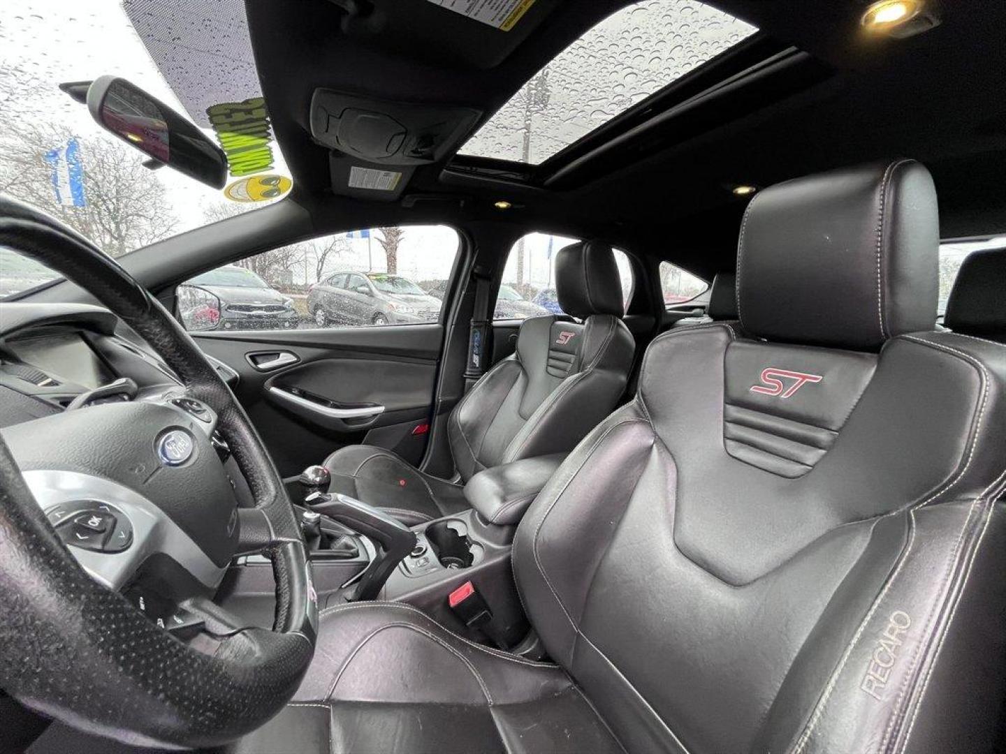 2013 Blue /Black Ford Focus (1FADP3L93DL) with an 2.0l I-4 DI T/C Ecoboost engine, Manual transmission, located at 745 East Steele Rd., West Columbia, SC, 29170, (803) 755-9148, 33.927212, -81.148483 - Special Internet Price! 2013 Ford Focus with AM/FM radio, Bluetooth, Navigation, Cruise control, Sunroof, Push to start, Keyless entry, Manual transmission, Powered windows, Powered door locks, Plus more! - Photo#22