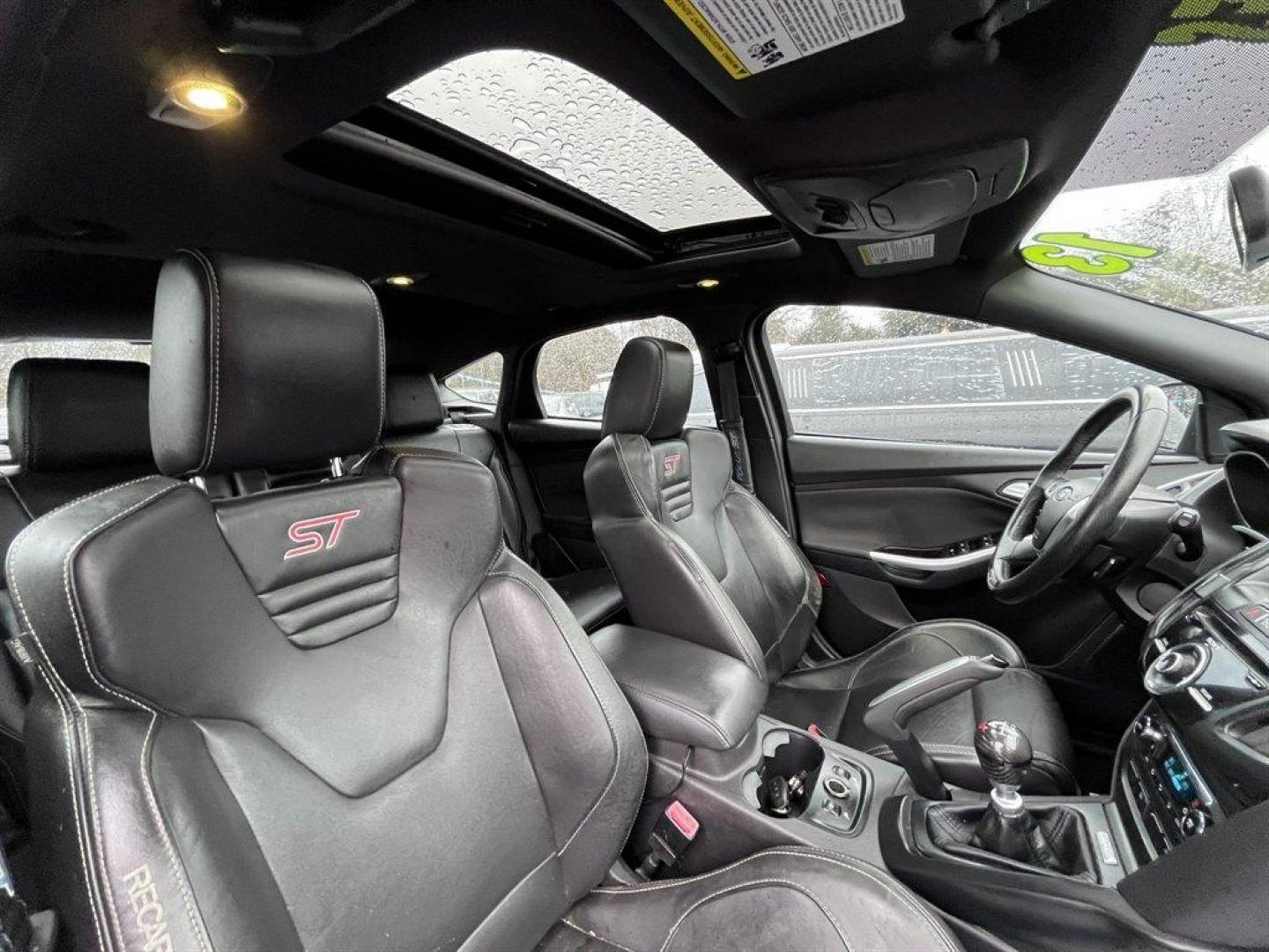 2013 Blue /Black Ford Focus (1FADP3L93DL) with an 2.0l I-4 DI T/C Ecoboost engine, Manual transmission, located at 745 East Steele Rd., West Columbia, SC, 29170, (803) 755-9148, 33.927212, -81.148483 - Special Internet Price! 2013 Ford Focus with AM/FM radio, Bluetooth, Navigation, Cruise control, Sunroof, Push to start, Keyless entry, Manual transmission, Powered windows, Powered door locks, Plus more! - Photo#29